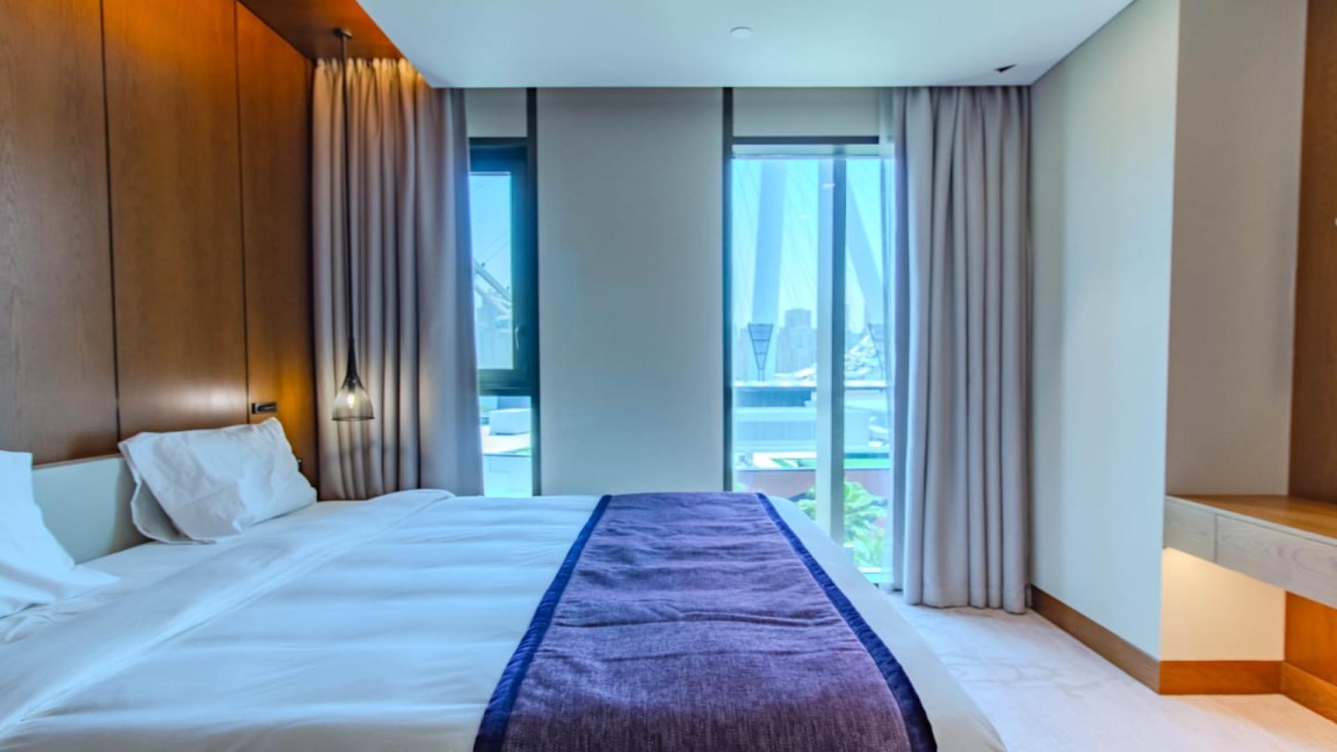 Modern kitchen in Bluewaters apartment, sleek design, spacious countertops, integrated appliances. LP42176