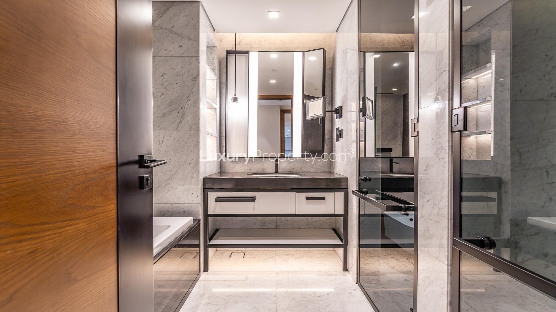 Modern open-plan kitchen and living area in Caesars Bluewaters Dubai apartment for rent