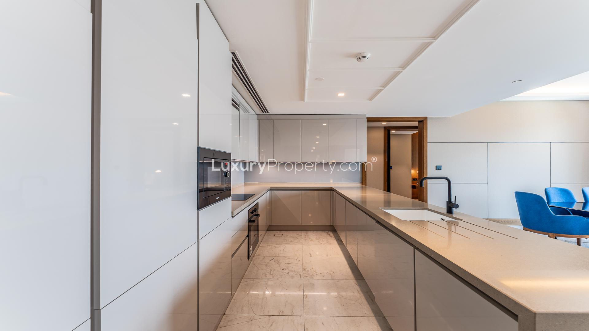 Modern open-plan kitchen and living area in Bluewaters apartment, Caesars Bluewaters Dubai