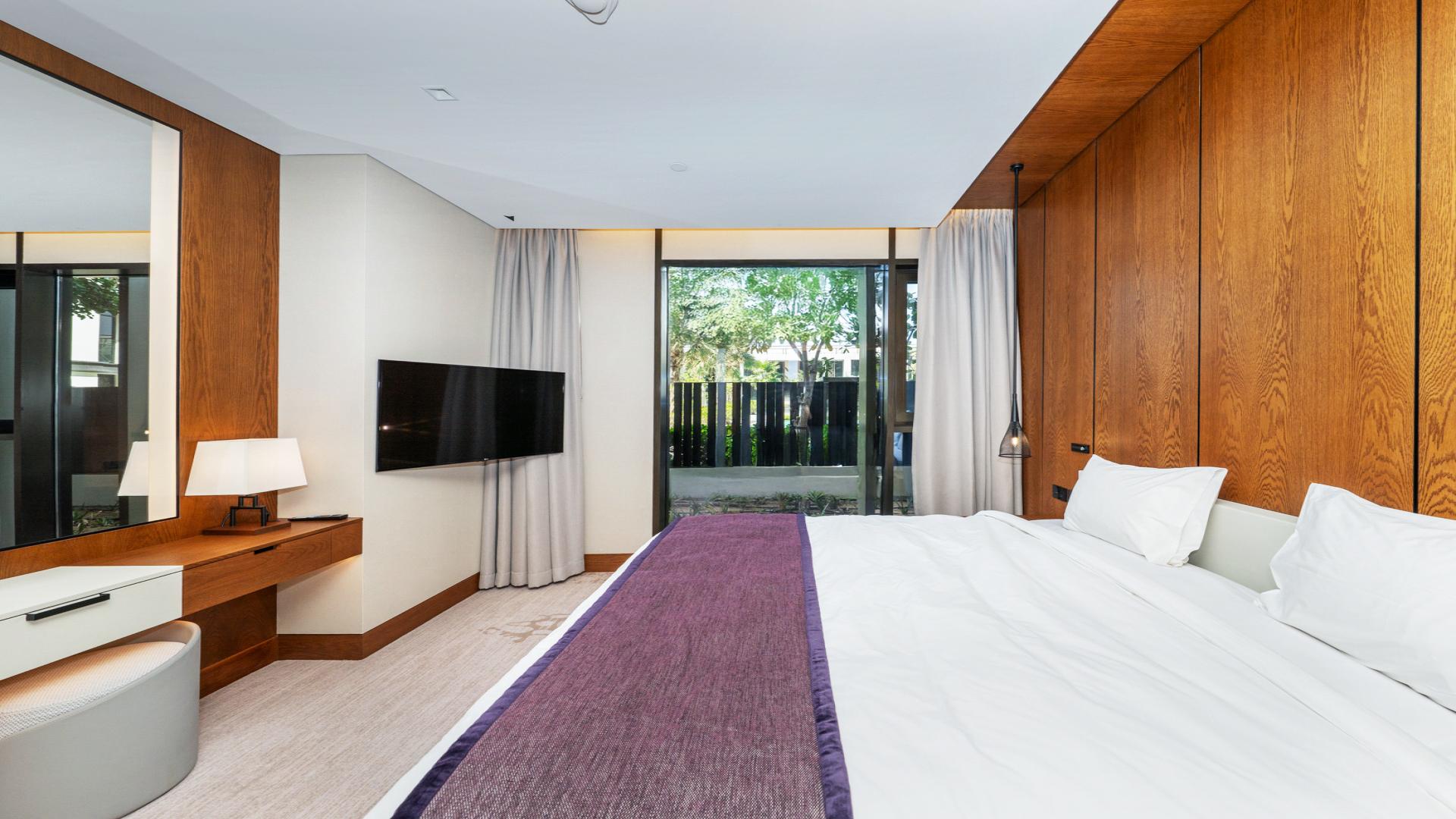 Modern open-plan living area in three-bedroom apartment, Caesar's Palace Residence, Bluewaters Island