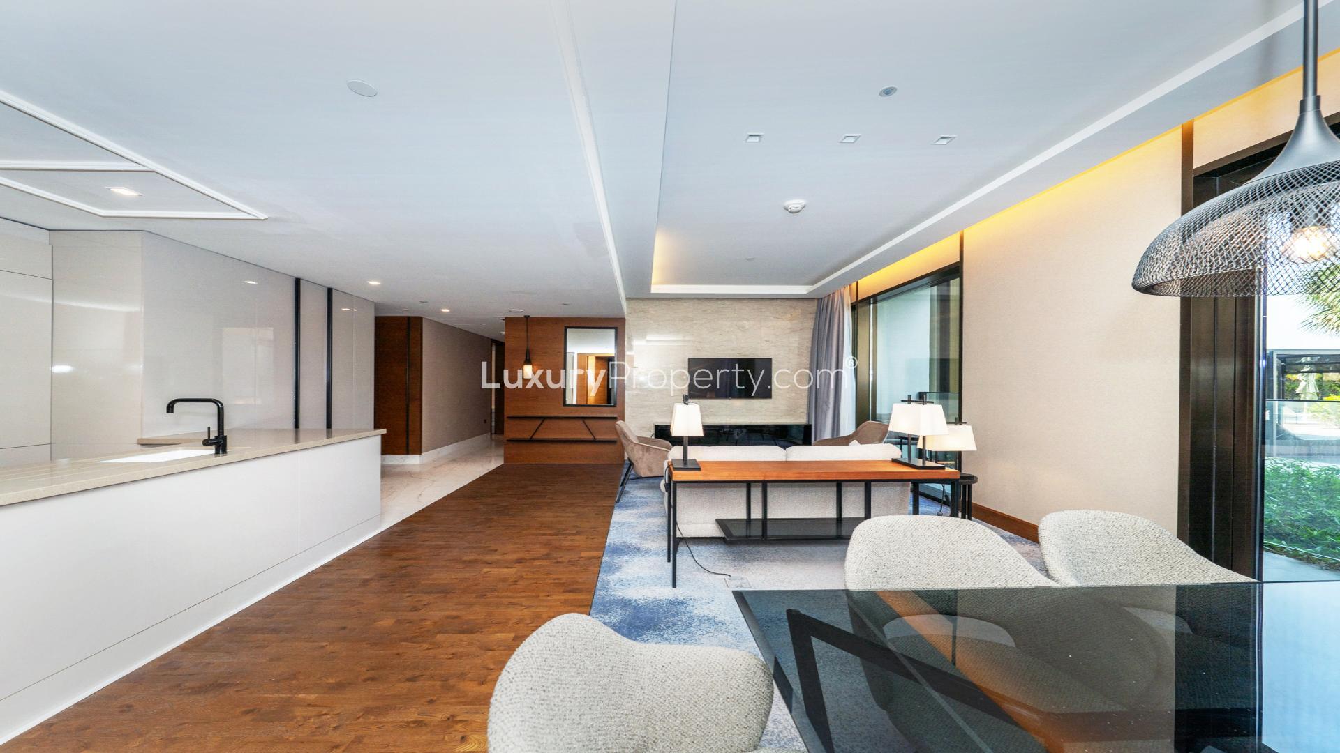 Luxurious living room and kitchen in three-bedroom apartment, Caesars Bluewaters Dubai, for rent
