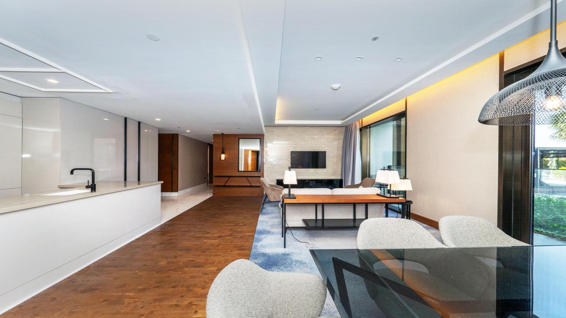 Luxurious living room and kitchen in three-bedroom apartment, Caesars Bluewaters Dubai, for rent