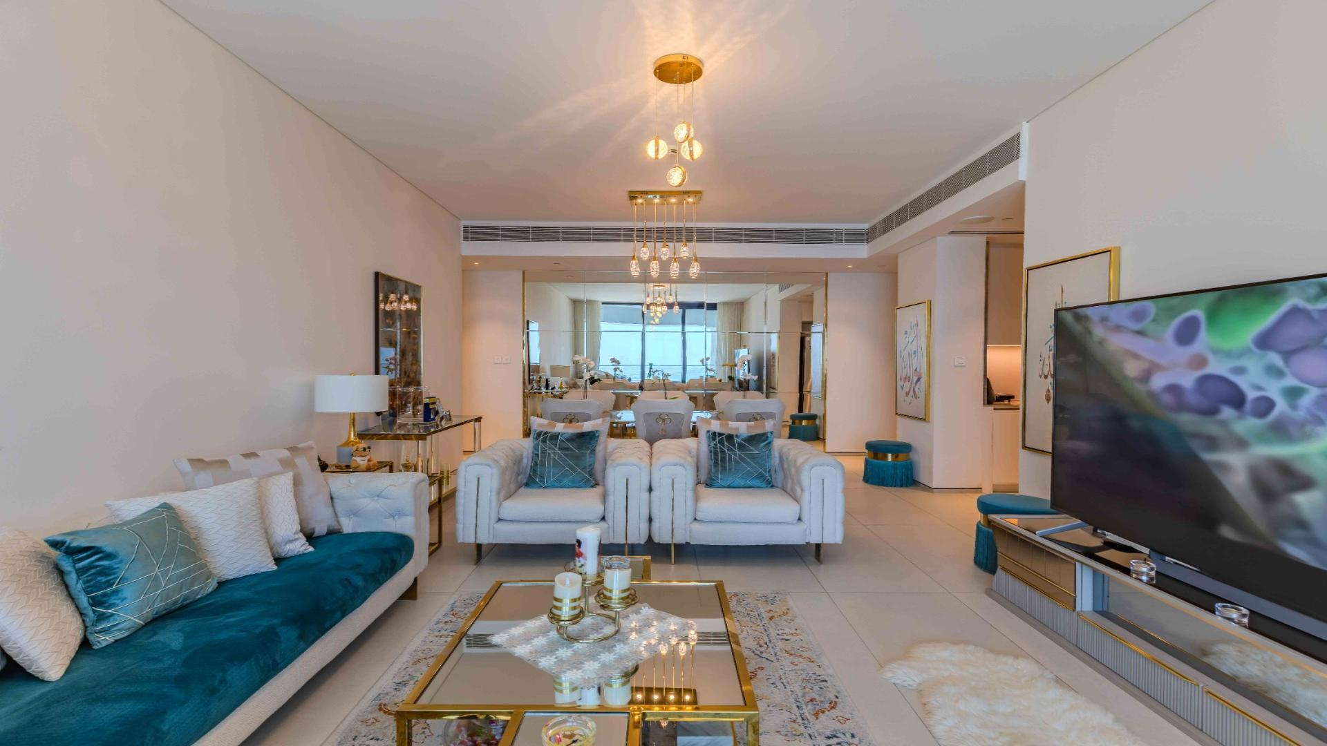 Luxurious living room in Jumeirah Gate Tower 1 apartment, modern decor, sea view balcony
