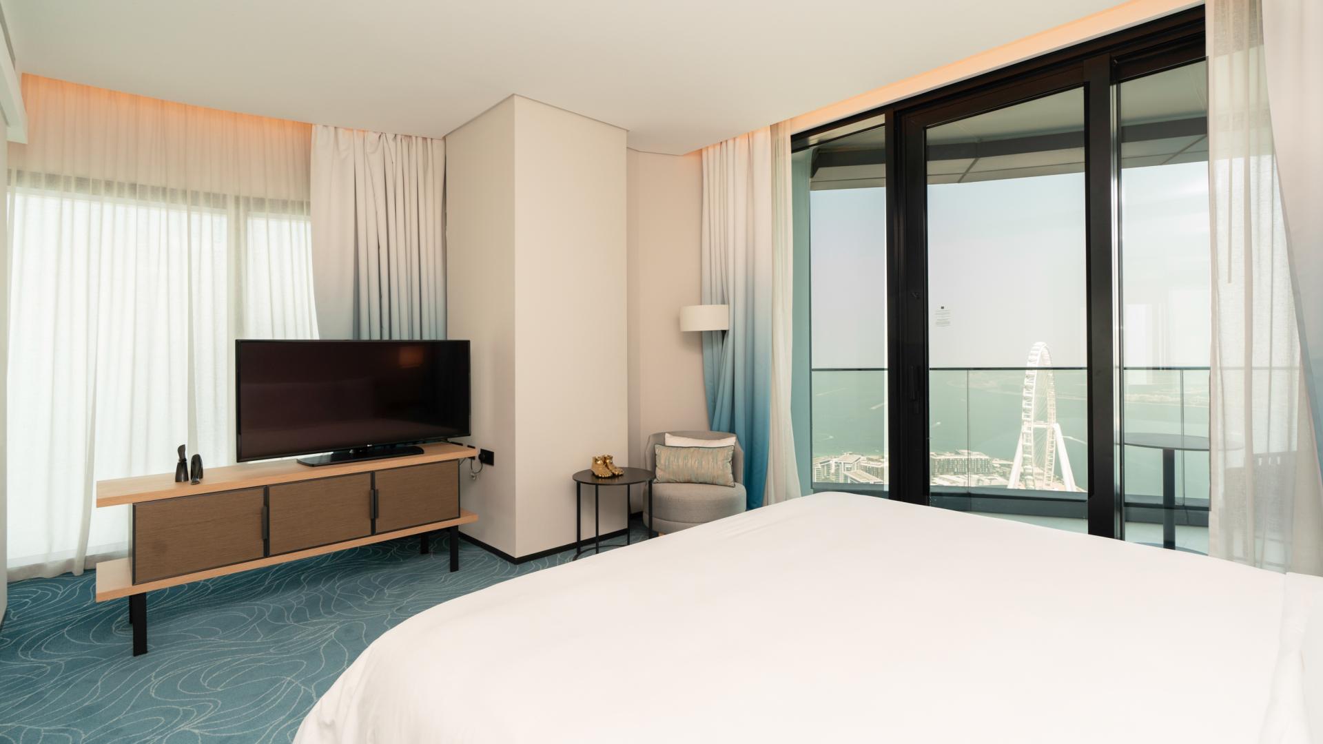 Modern living and dining area in Jumeirah Gate Tower 2 apartment, Jumeirah Beach Residence