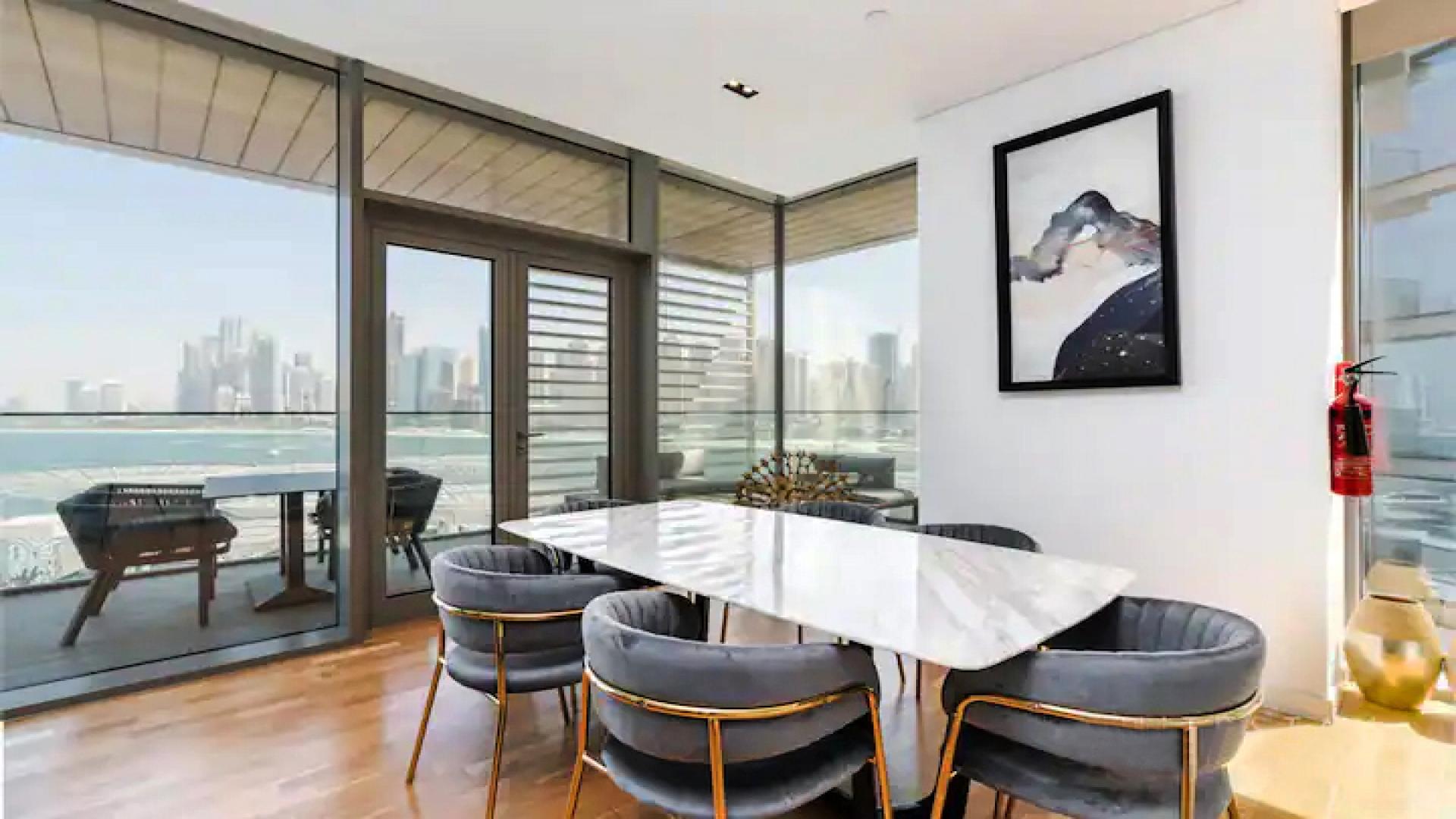 Modern kitchen and dining area in Bluewaters apartment for rent, high-end finishes, open layout
