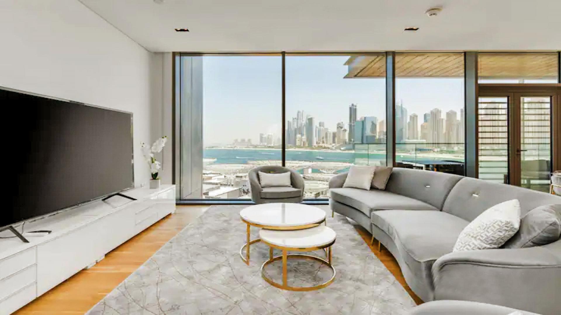 Modern dining area with skyline and sea view in Bluewaters Residences apartment for rent