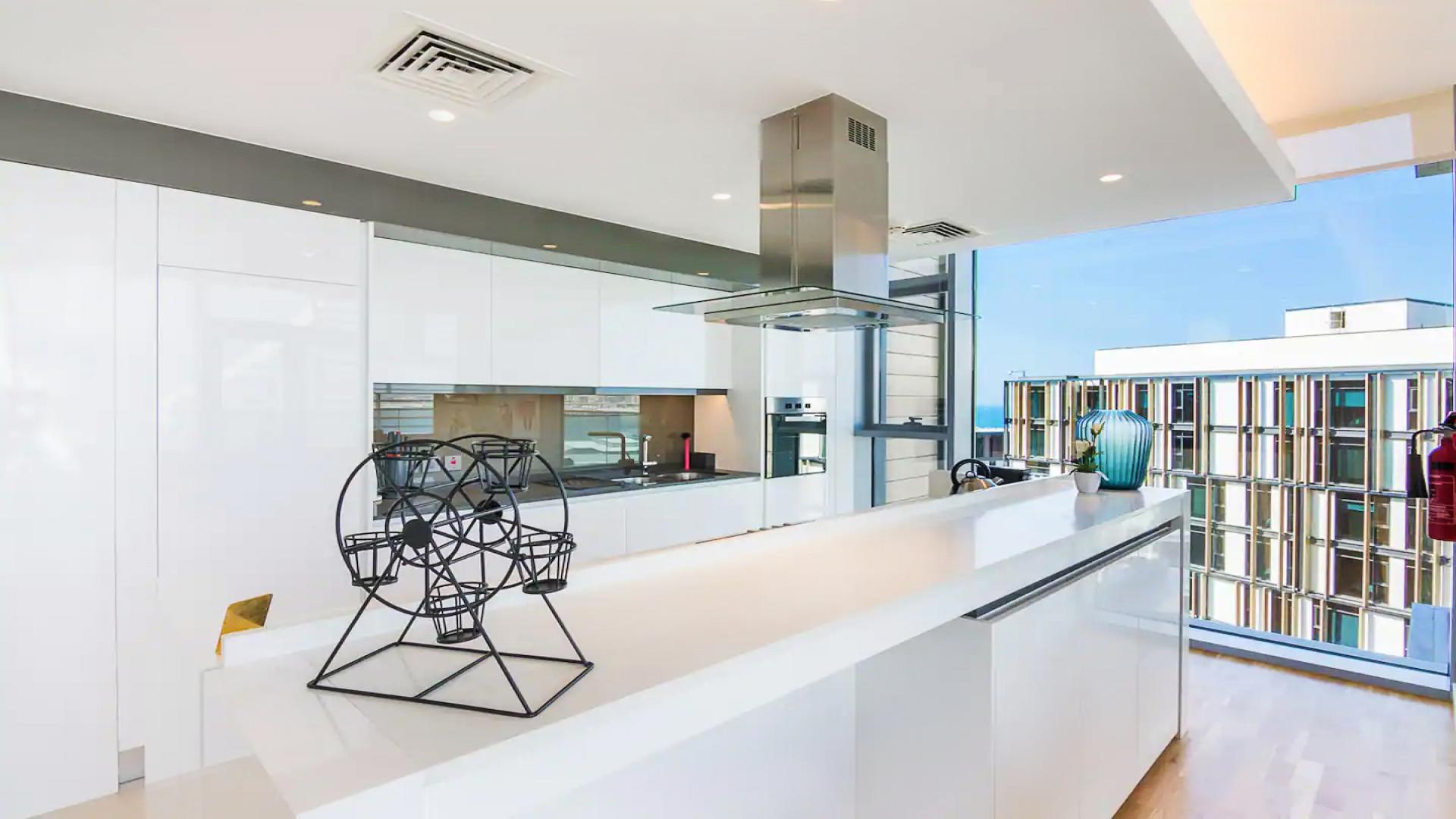 Modern kitchen with sea and marina views in Bluewaters Residences apartment, Dubai