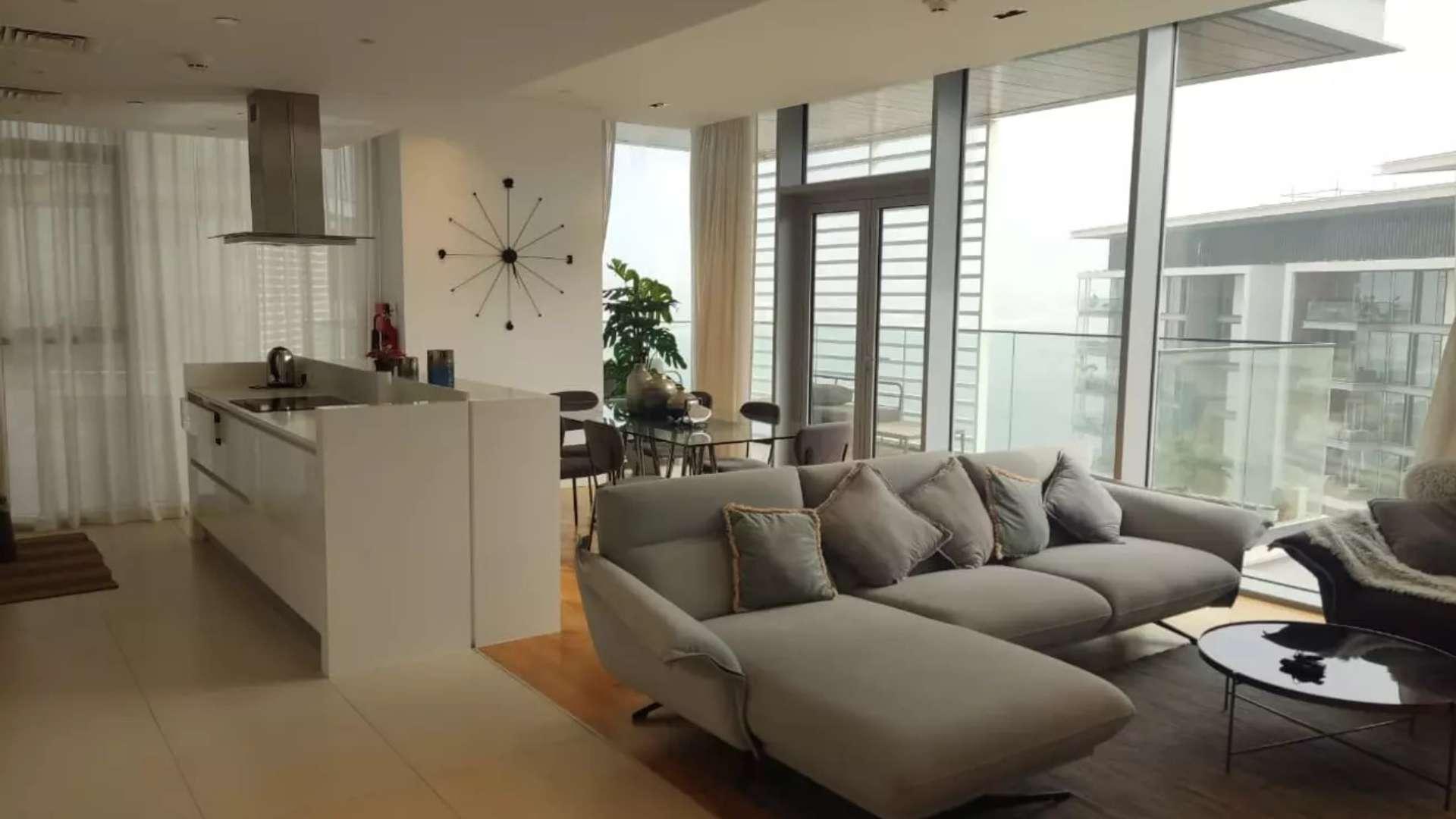 Furnished Bluewaters apartment with partial sea view, lush greenery, and modern architecture