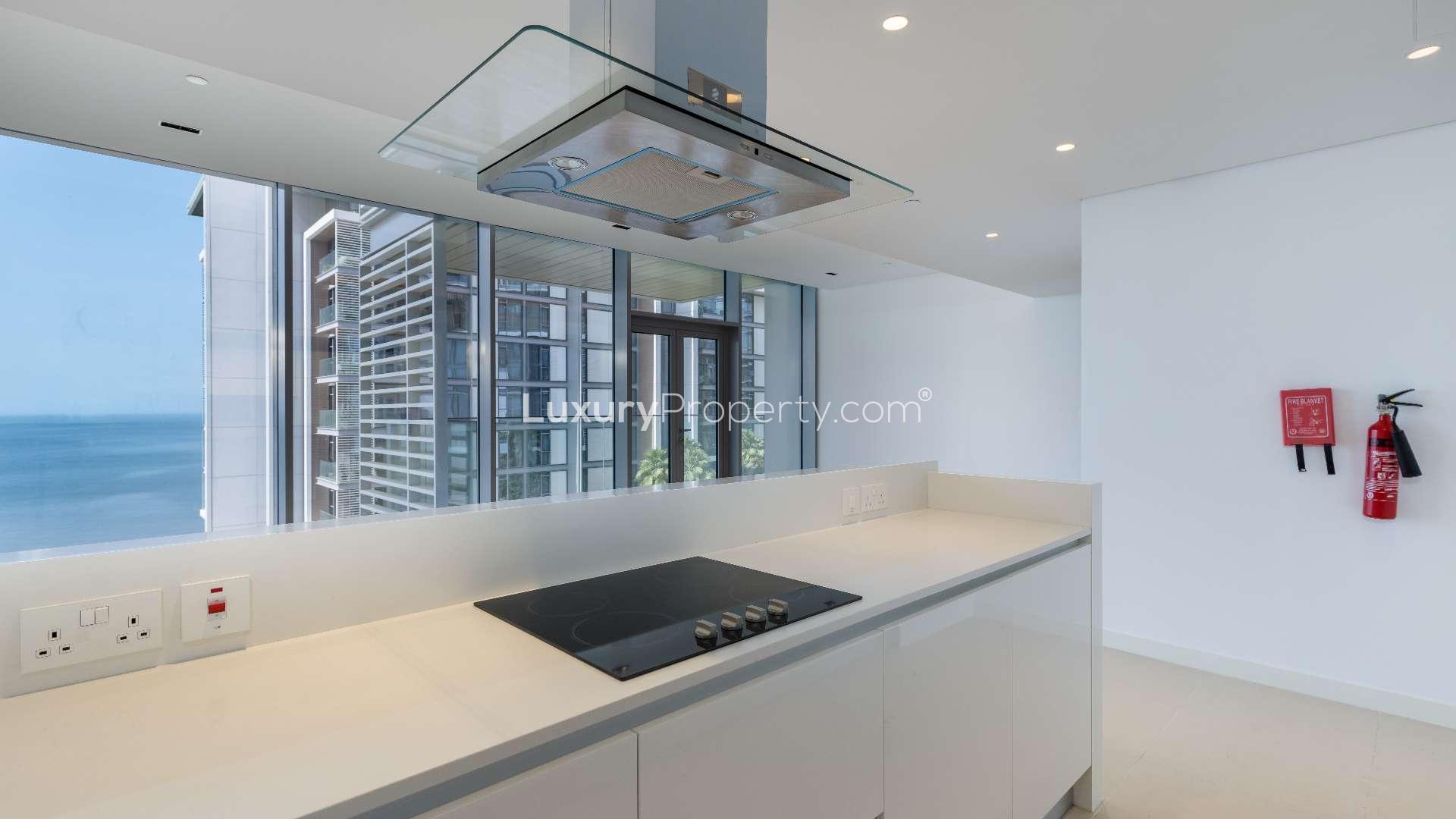 Bright living room with ocean view in Bluewaters Island apartment for rent