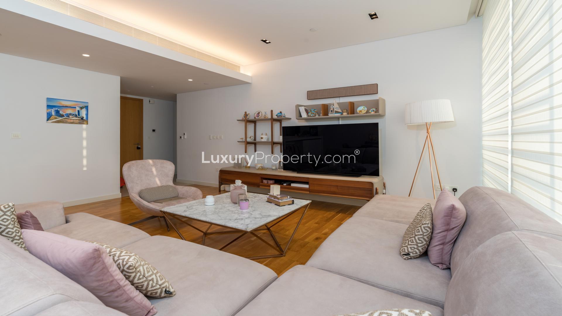 Furnished living room in Bluewaters Residences apartment with modern decor and natural light