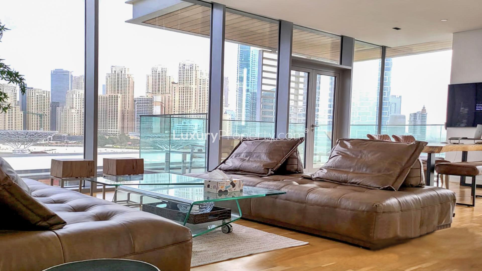 Modern dining area with city view in Bluewaters Island apartment, Dubai