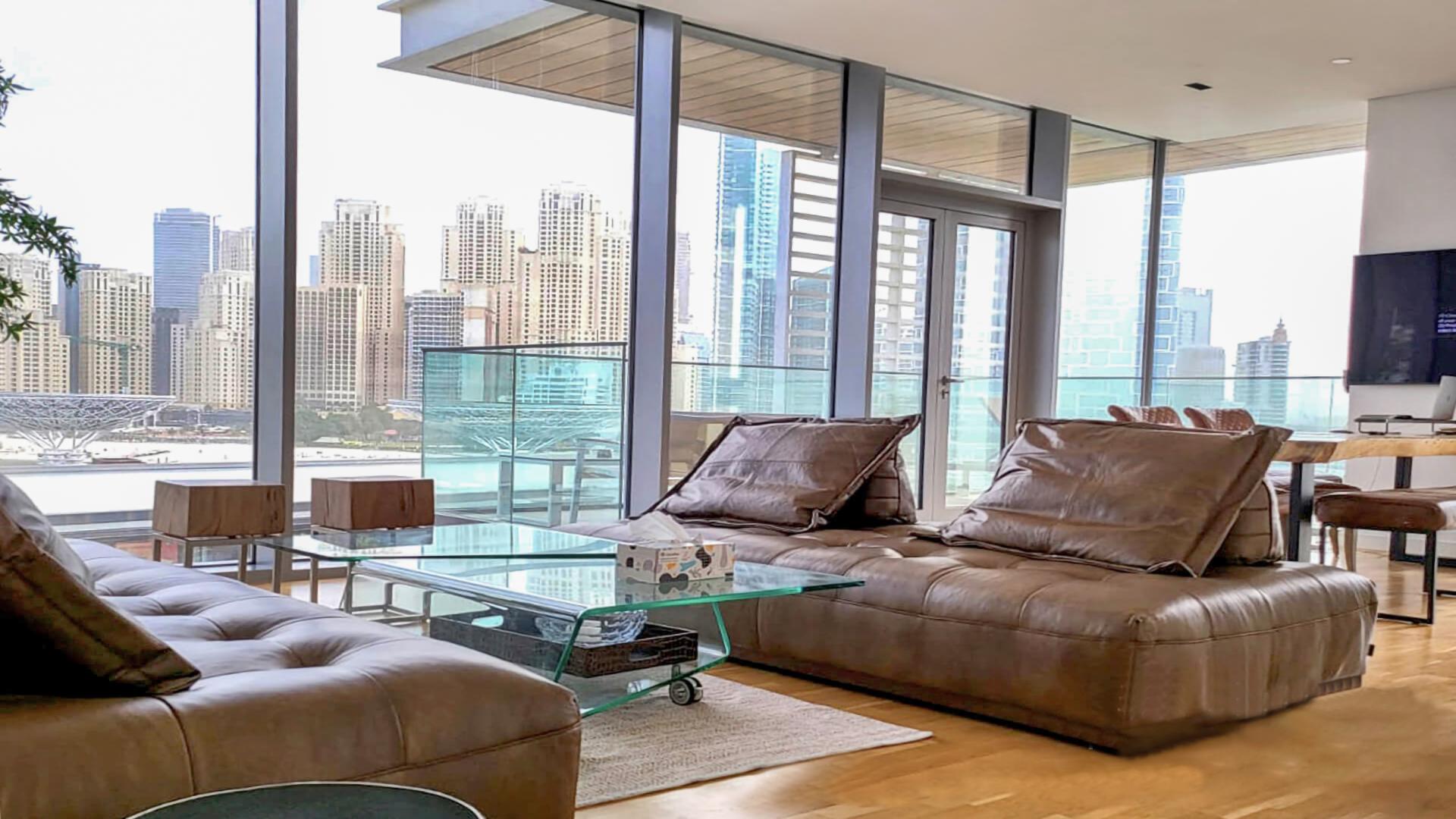 Modern dining area with city view in Bluewaters Island apartment, Dubai