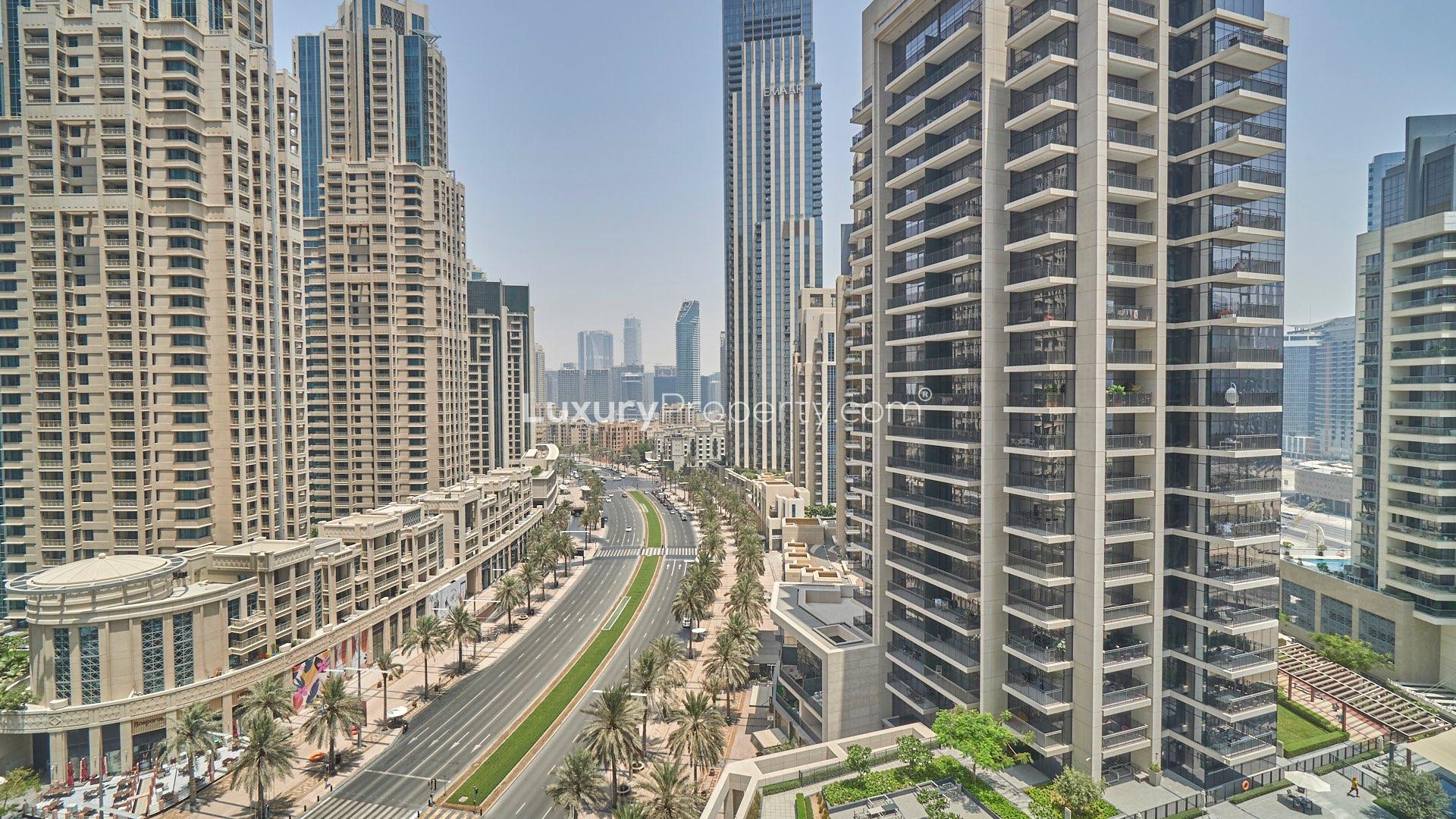 Aerial view of BLVD Crescent apartment complex with pool, Downtown Dubai skyline backdrop