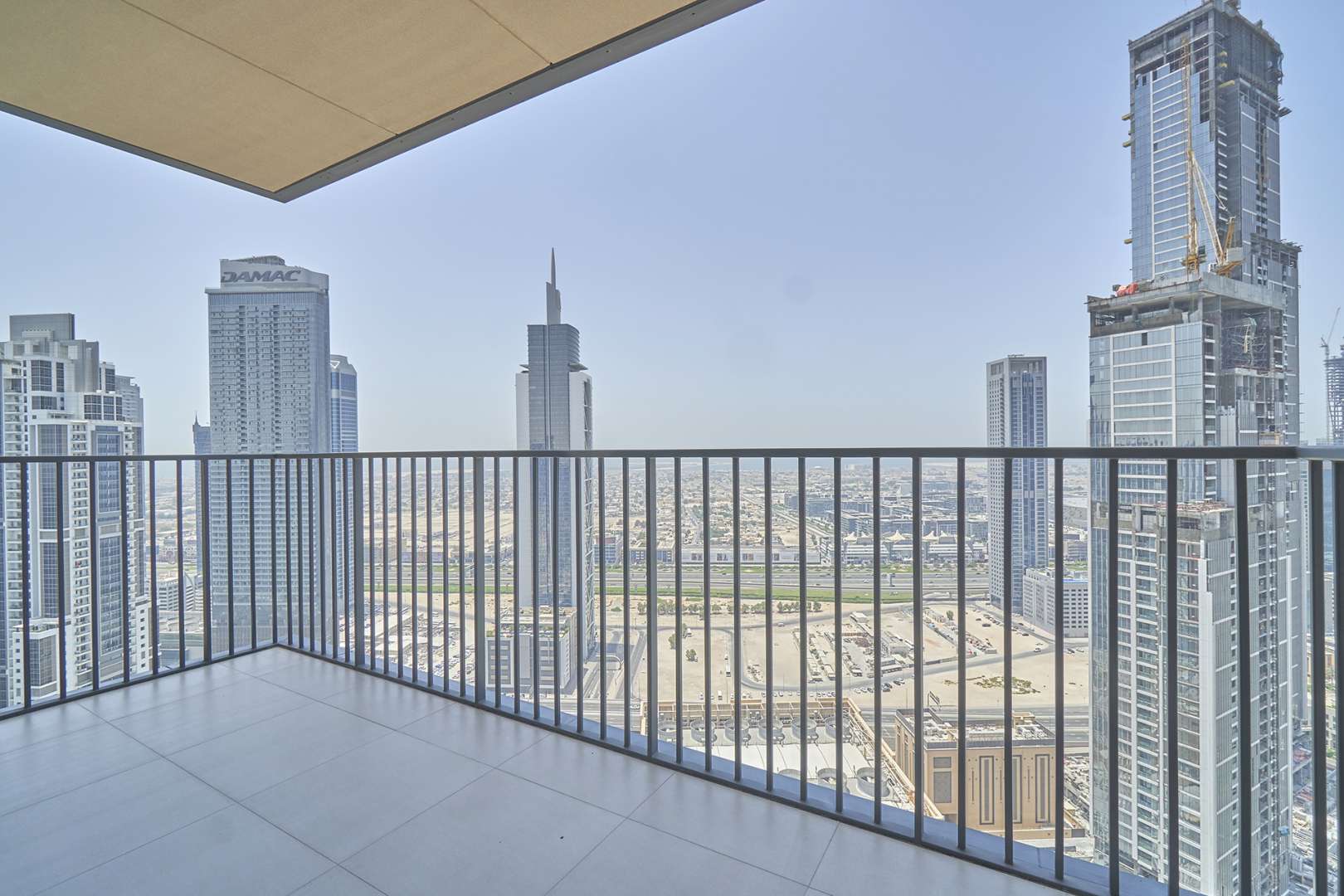 Spacious living room with floor-to-ceiling windows in BLVD Heights, Downtown Dubai apartment