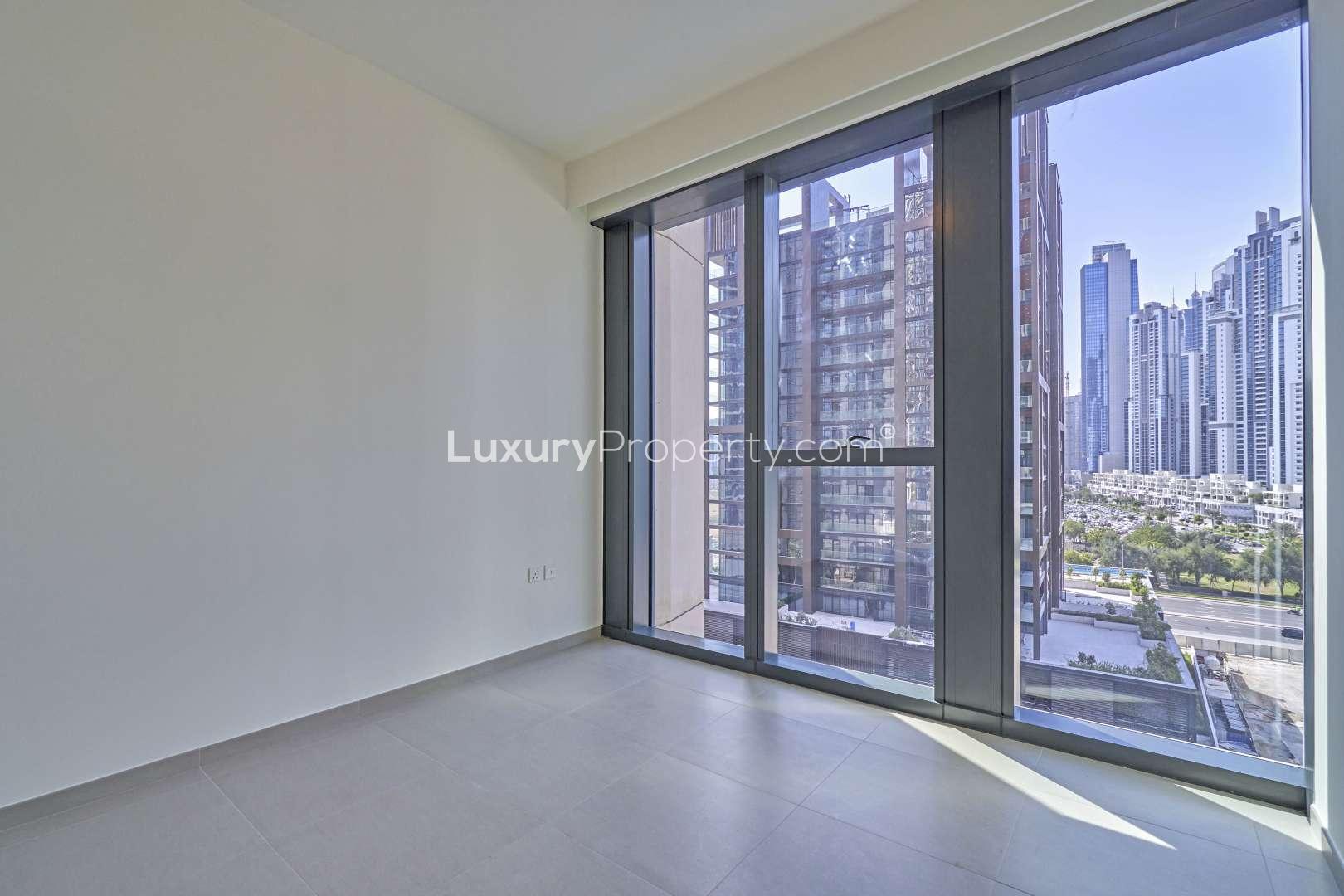 BLVD Heights apartment pool view, Downtown Dubai, three-bedroom rental property, luxury amenities