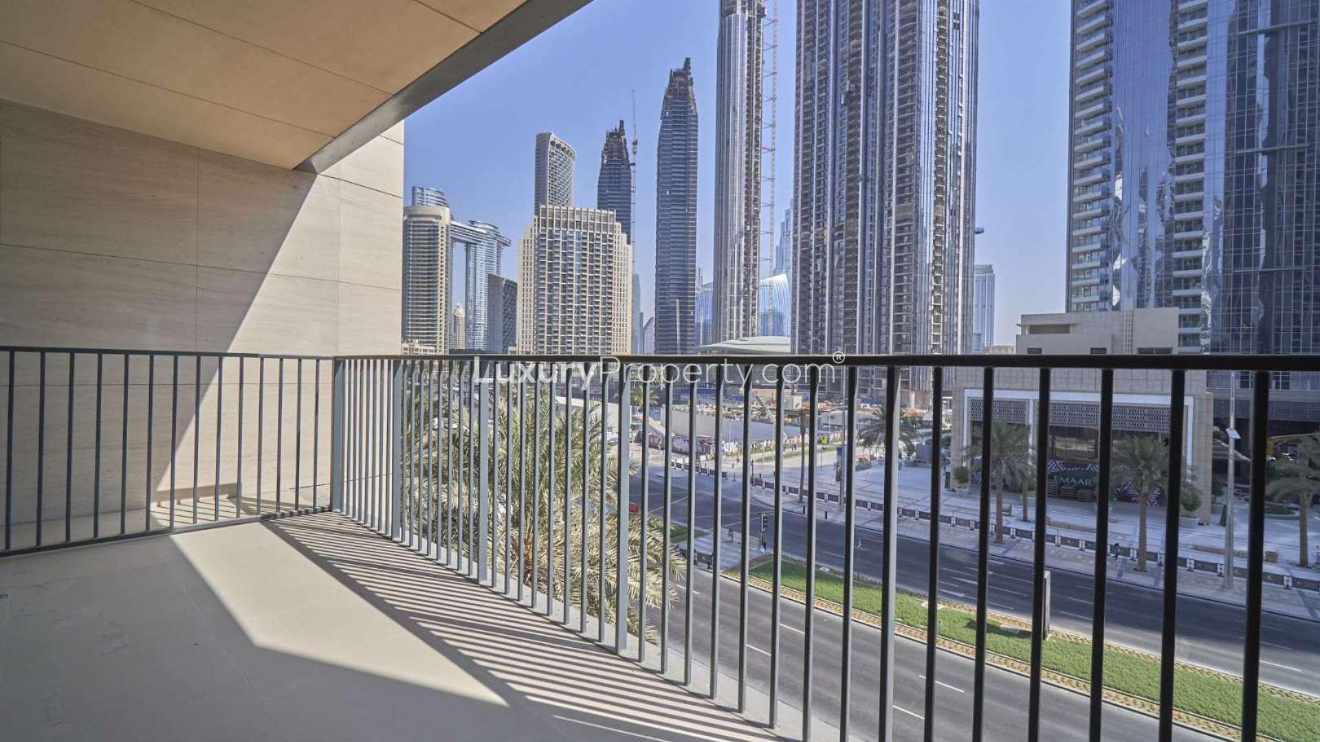 "Bright living room with large windows, stunning view in BLVD Heights, Downtown Dubai apartment.",Balcony view from duplex apartment in BLVD Heights, Downtown Dubai, overlooking skyscrapers