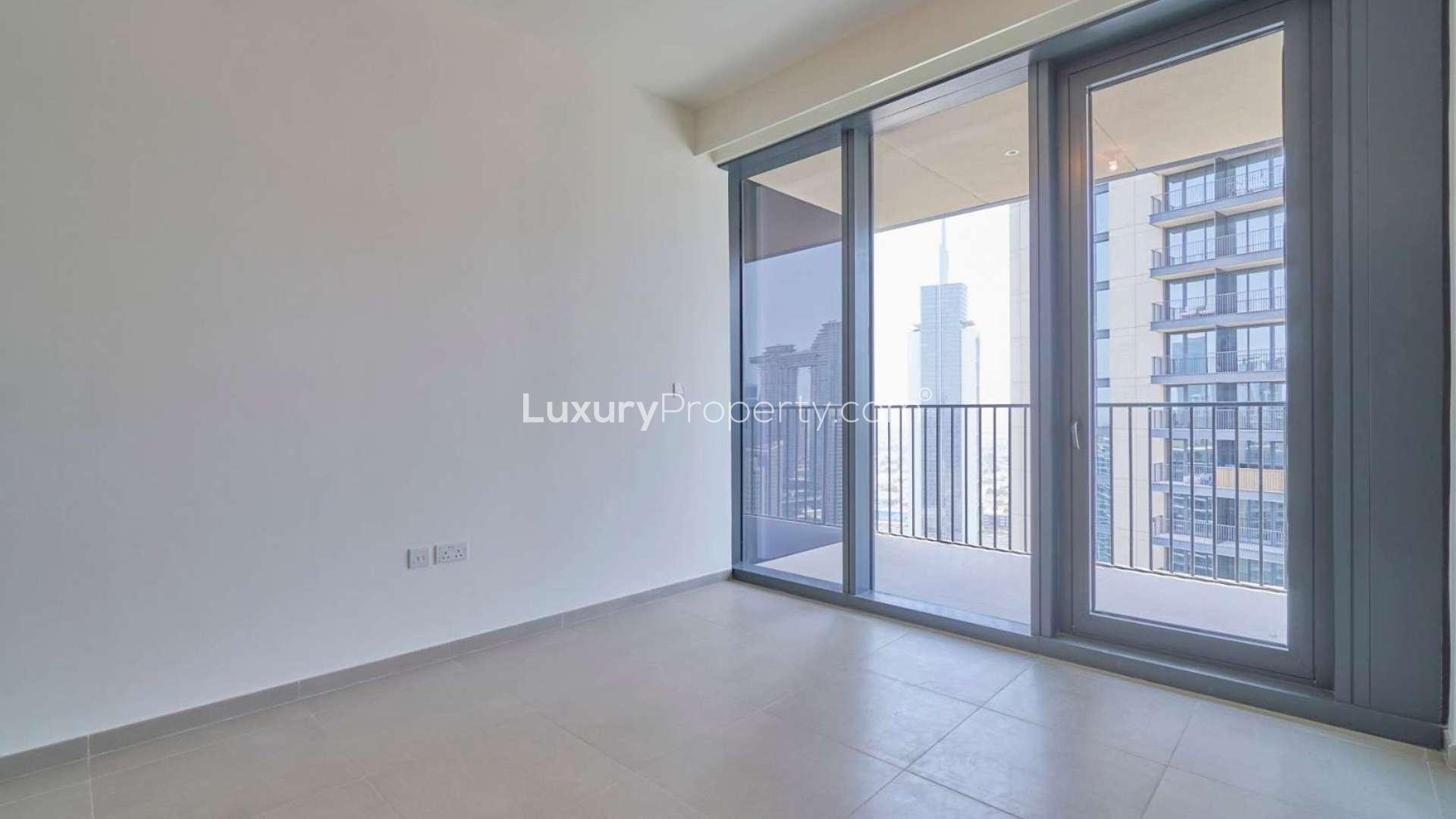 "Bright living area with city view in duplex apartment, BLVD Heights, Downtown Dubai.",Balcony view from duplex apartment in BLVD Heights, Downtown Dubai with cityscape