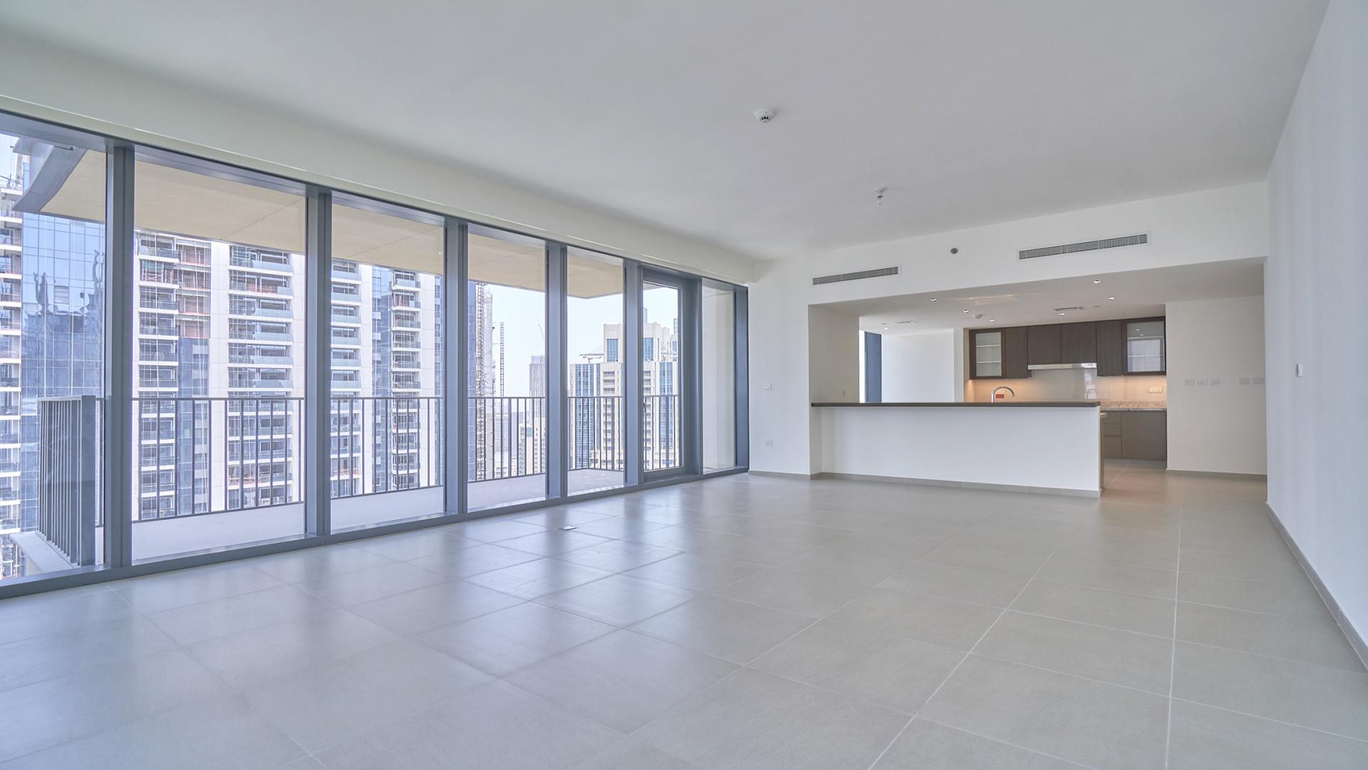 "Downtown Dubai apartment balcony view, high-rise buildings, available for rent, BLVD Heights.",Spacious apartment interior with floor-to-ceiling windows and downtown views, BLVD Heights, Downtown Dubai