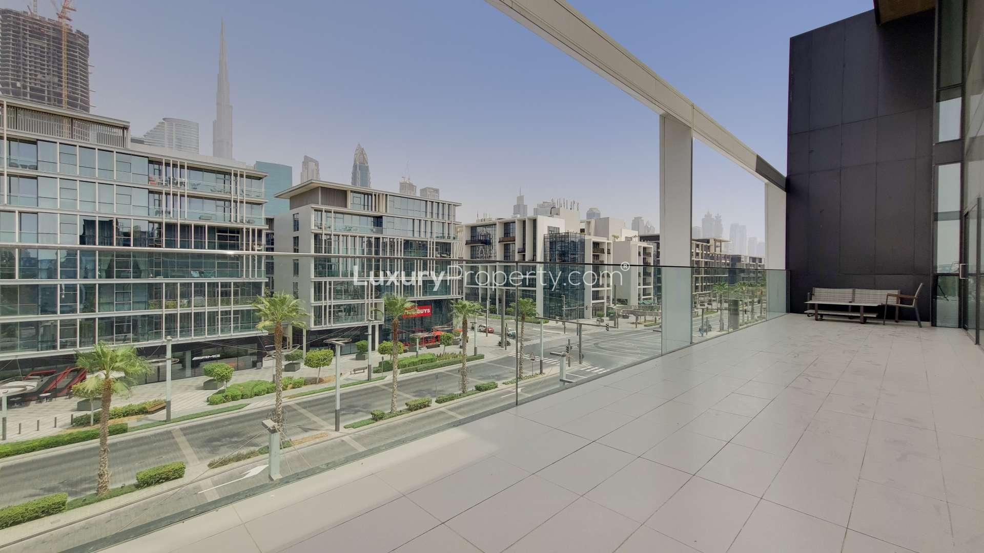 Spacious living area in City Walk duplex apartment with modern decor and open-plan design