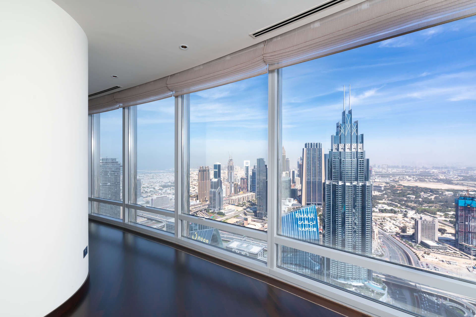 Luxurious apartment interior with city view, hardwood floors, and modern kitchen in Burj Khalifa