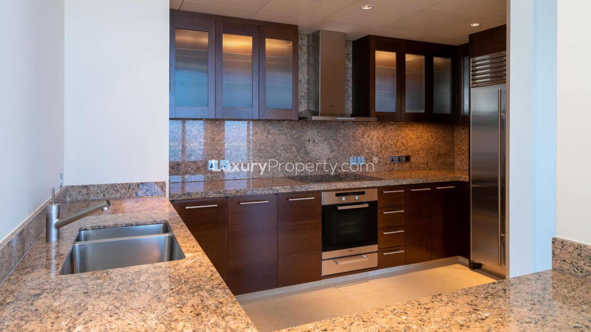 Luxurious open-plan living area with floor-to-ceiling windows in Burj Khalifa apartment