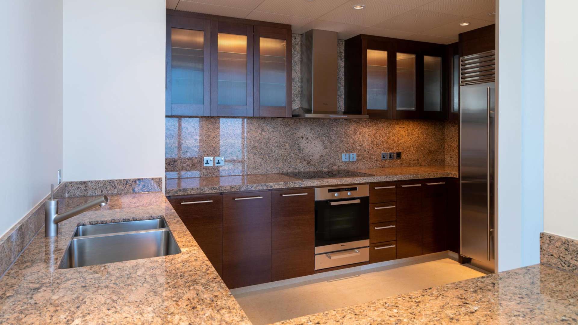 Luxurious open-plan living area with floor-to-ceiling windows in Burj Khalifa apartment