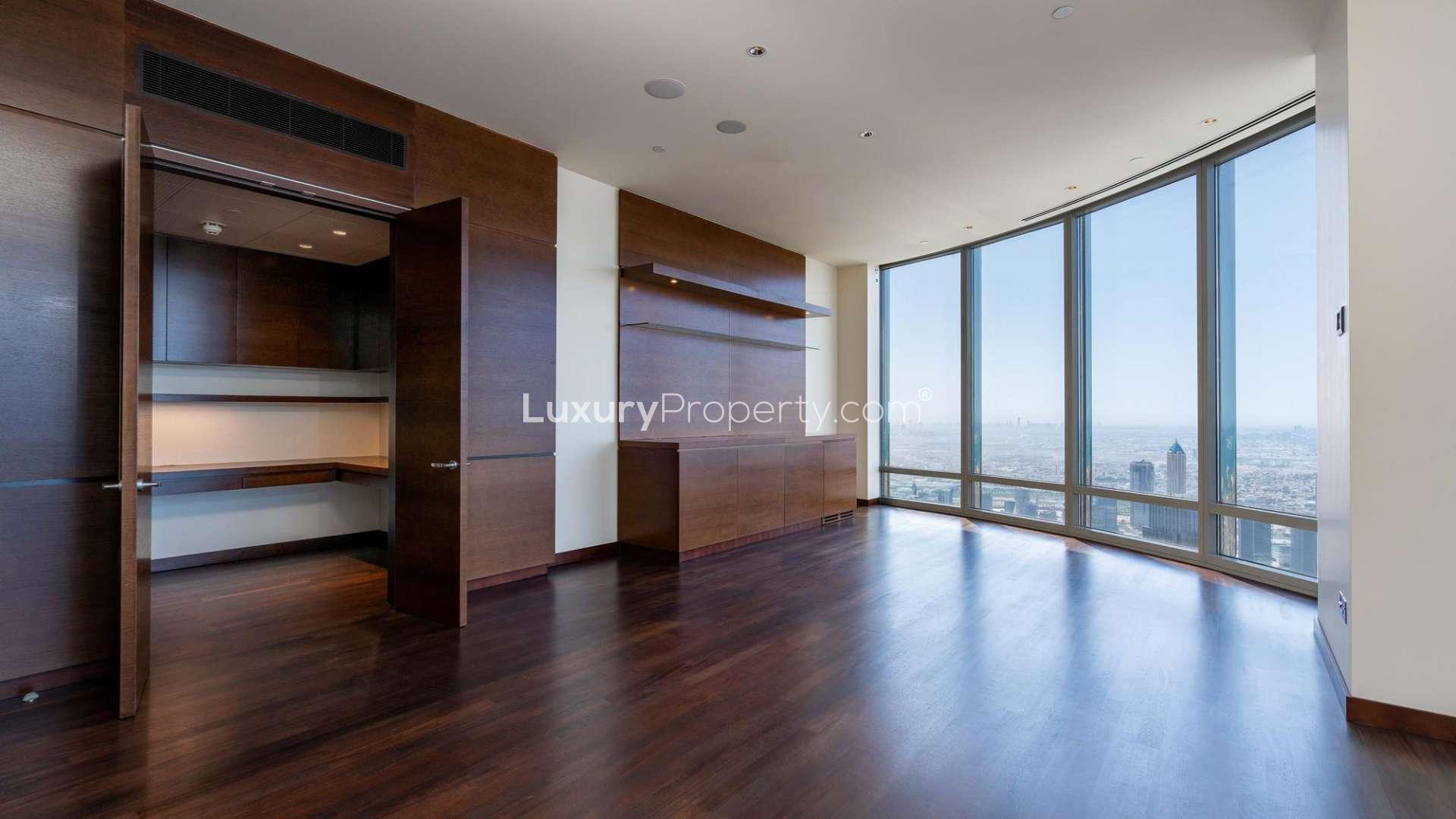 "Elegant living area with floor-to-ceiling windows in Burj Khalifa apartment, Downtown Dubai.",Spacious living area with floor-to-ceiling windows in Burj Khalifa apartment, Downtown Dubai