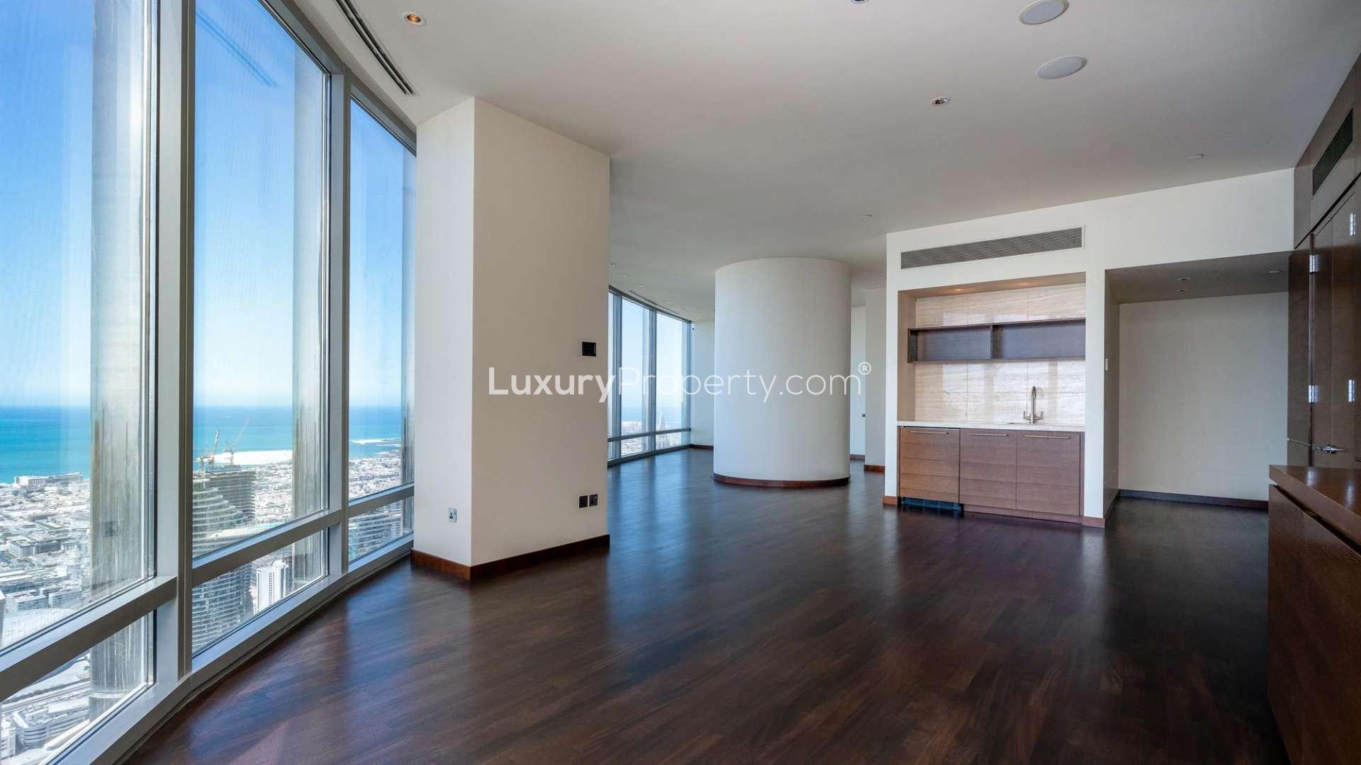 Spacious apartment interior with floor-to-ceiling windows and city views in Burj Khalifa, Dubai