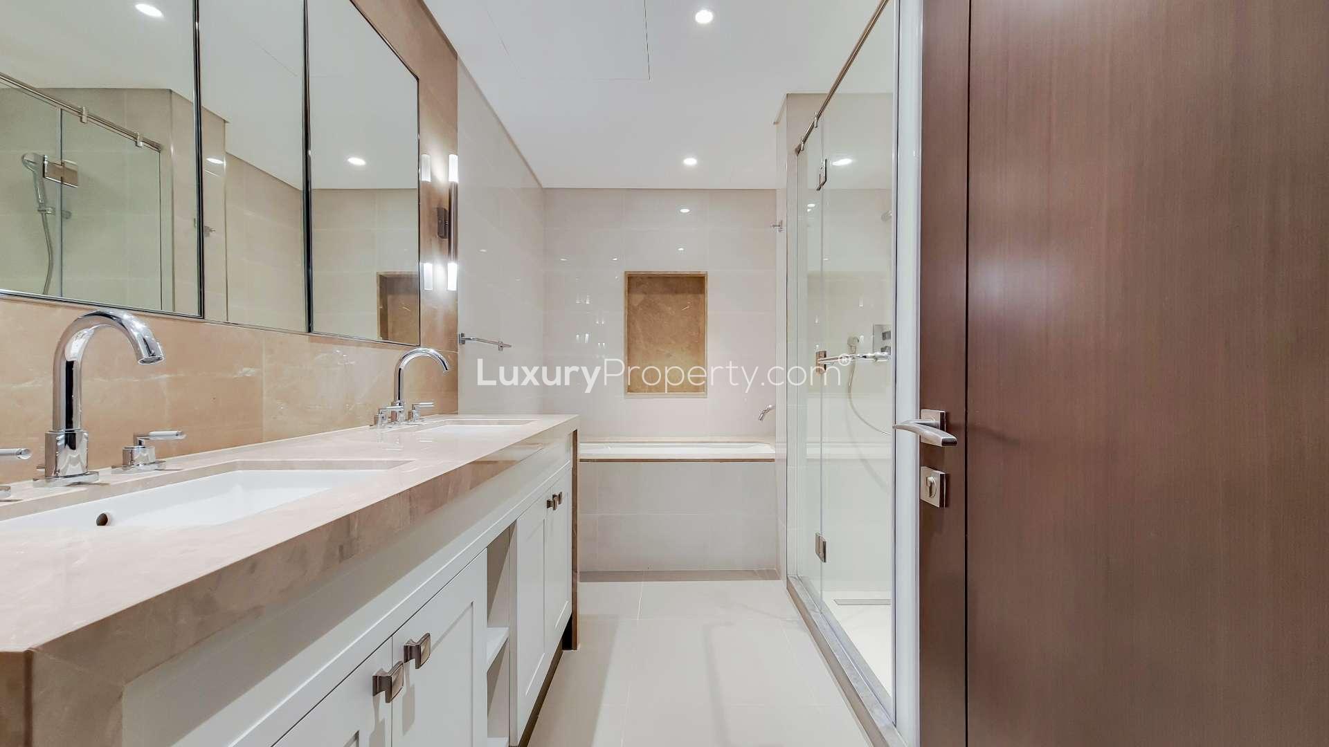 Empty modern apartment with large windows showing Burj Khalifa view in Downtown Dubai