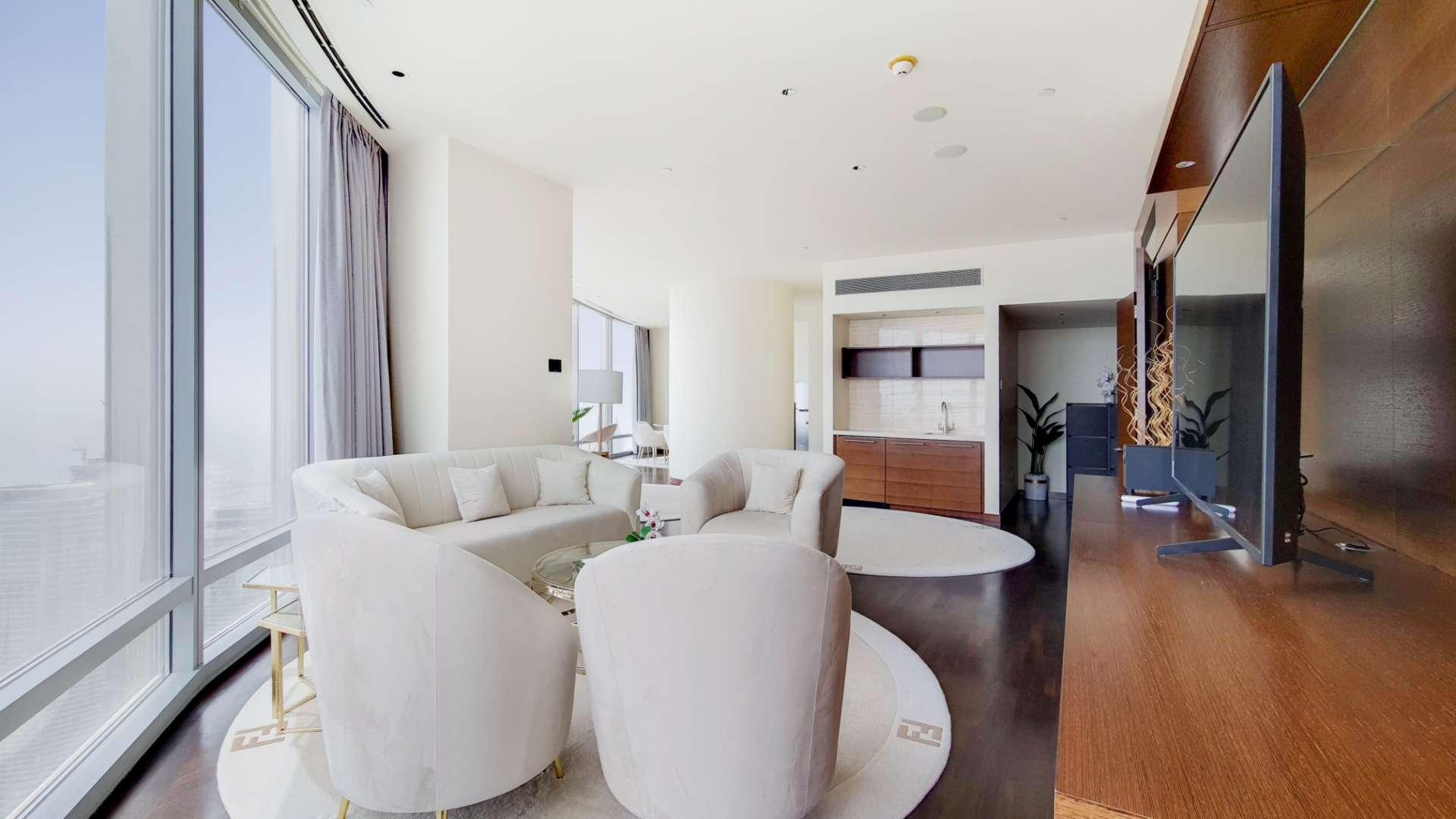 Luxurious living room in Burj Khalifa apartment with modern furnishings and panoramic windows