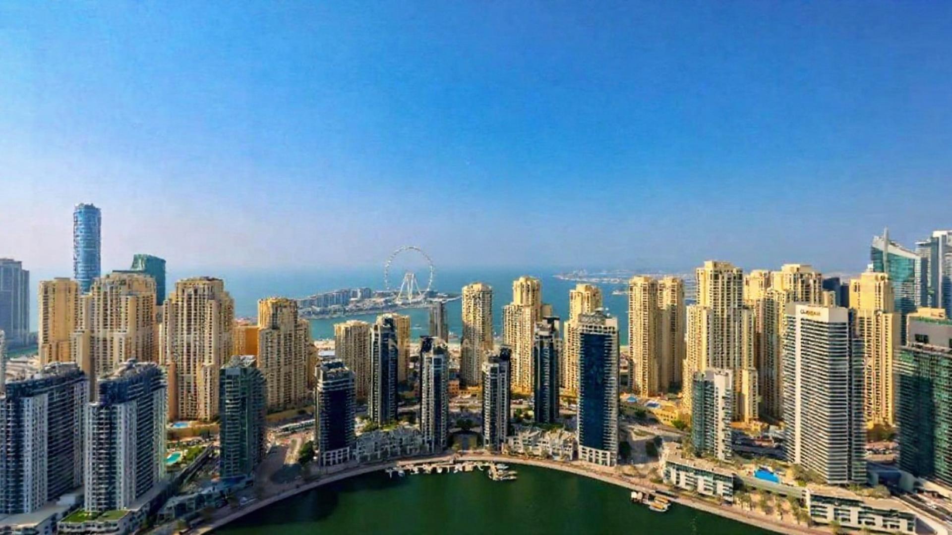 Modern living room in Vida Residences Dubai Marina apartment for rent, featuring stylish decor