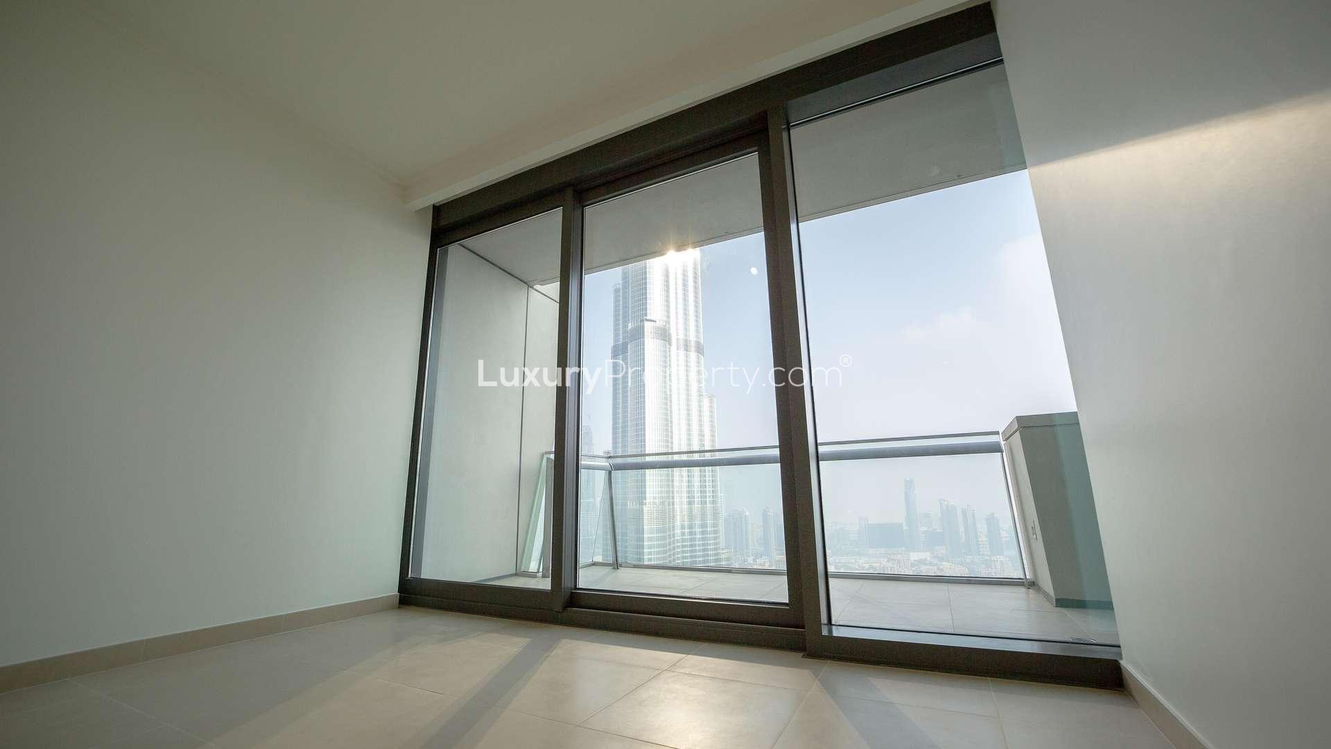 Modern kitchen in 3-bedroom Burj Vista apartment, Downtown Dubai, featuring sleek countertops and appliances
