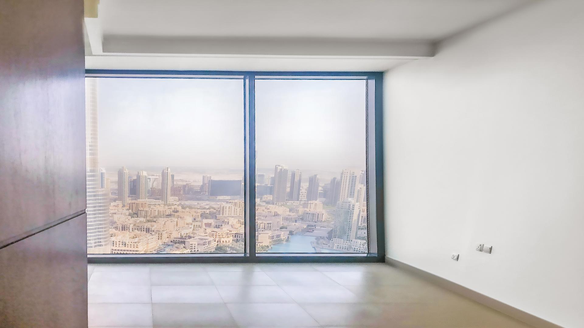 Skyline view from Burj Vista apartment, Downtown Dubai, showcasing cityscape and Burj Khalifa