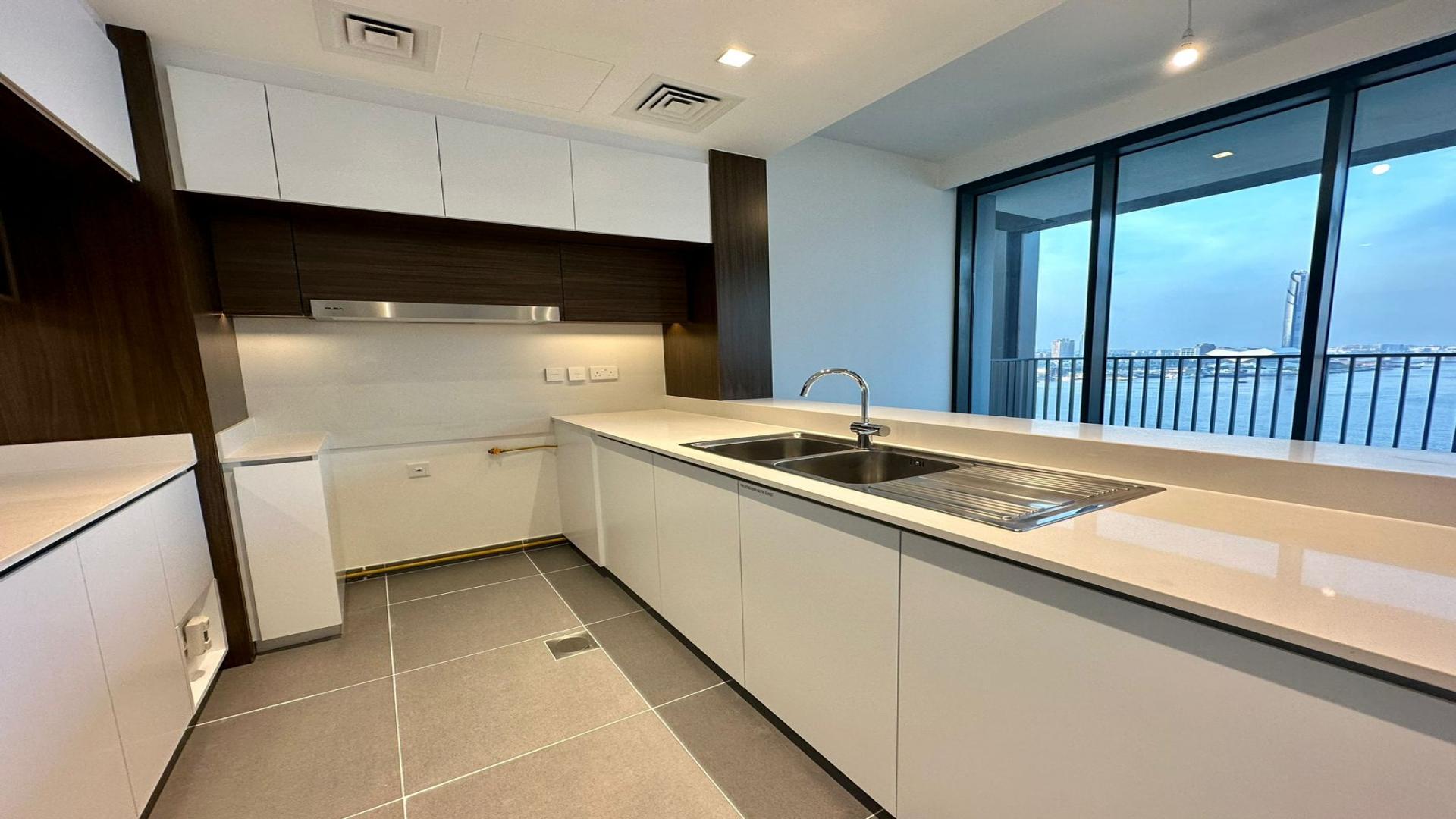 Brand new Creek Edge apartment kitchen with Dubai skyline view, Dubai Creek Harbour