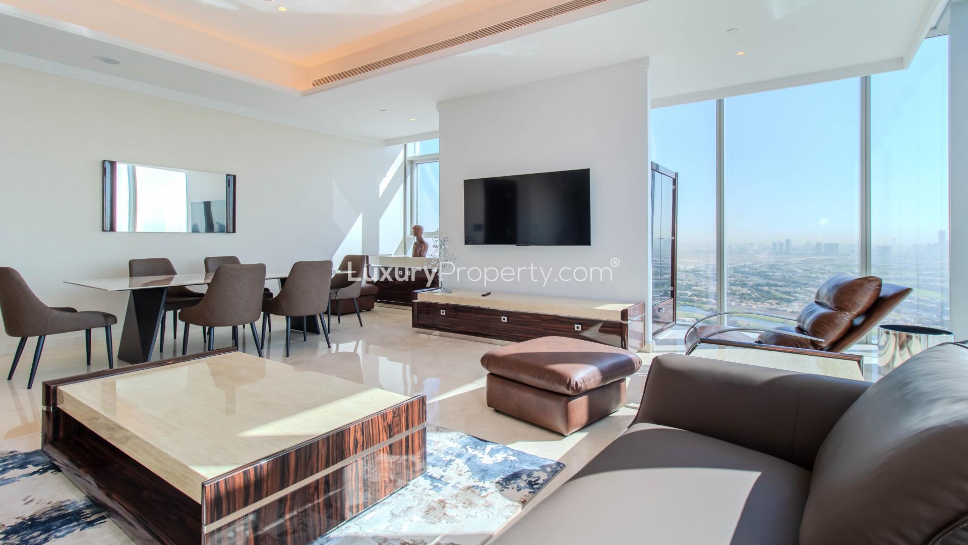 "Stunning balcony view from apartment overlooking golf course in Jumeirah Lake Towers, for rent.","Modern living room with golf course view in JLT apartment for rent, LP39547.",Stylish living and dining area in JLT apartment with modern furnishings and elegant decor