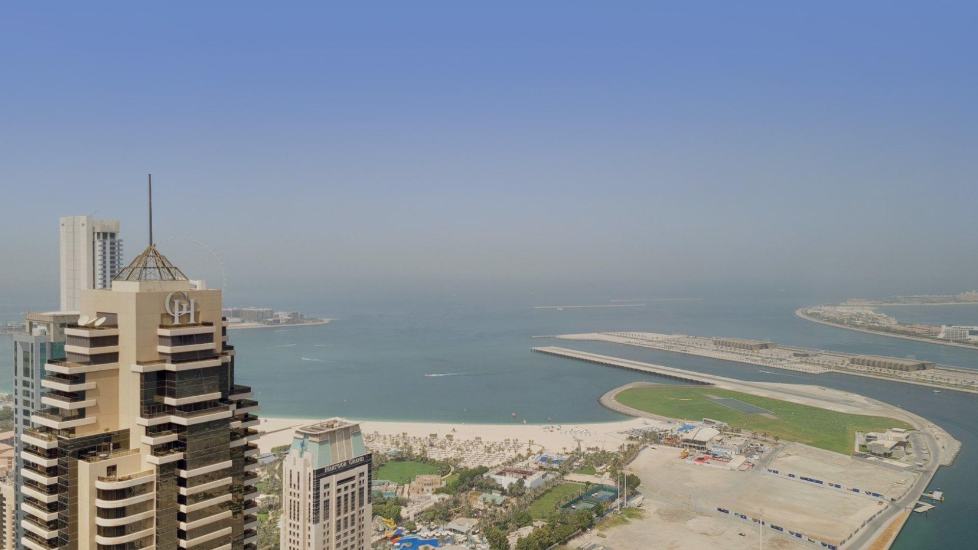 Luxury furnished living room in Cayan Tower, Dubai Marina apartment with city views