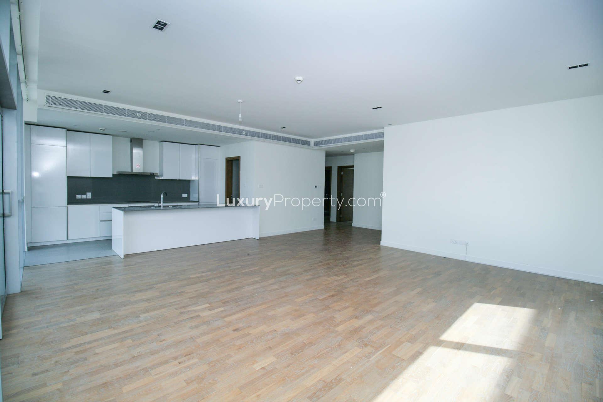 Bright open-plan living area with modern kitchen in City Walk apartment, Dubai