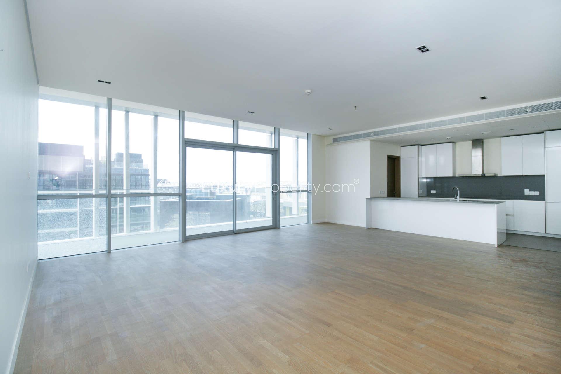 Empty room with large window in City Walk Dubai apartment for rent