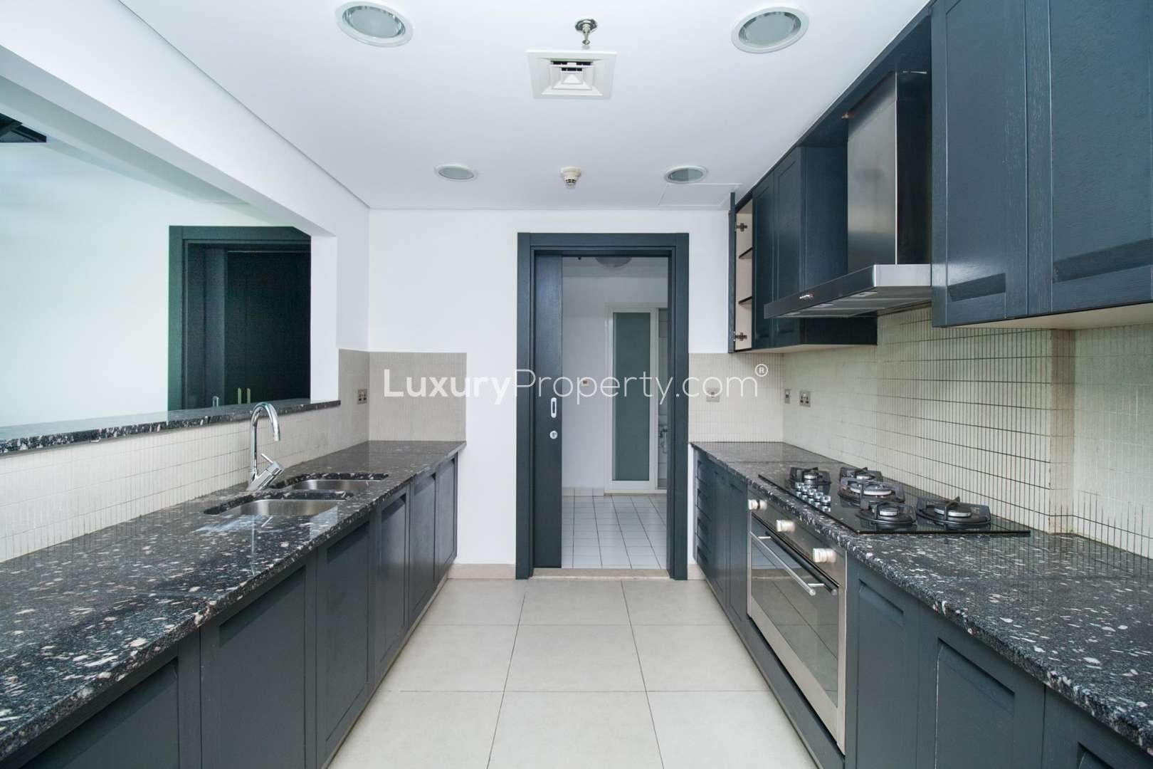 Modern duplex interior with staircase in Jumeirah Heights apartment for rent, Cluster A