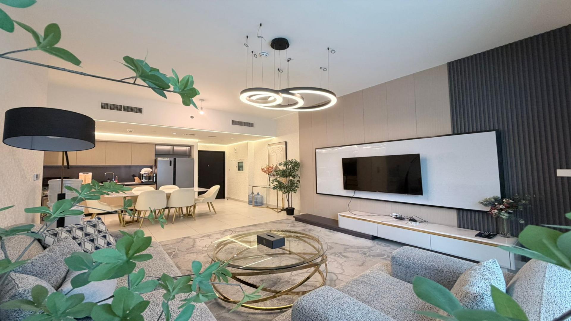 Luxurious living room with Italian furniture in upgraded high-floor Burj Crown apartment, Downtown