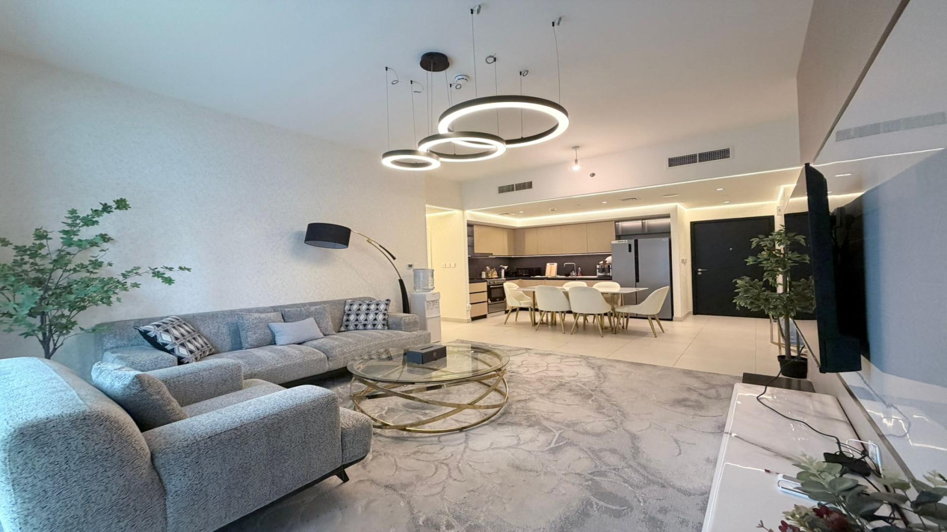 High-floor Burj Crown apartment with Italian furniture, modern kitchen, and spacious living area