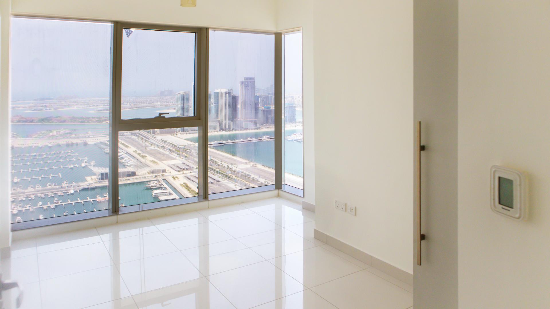 Modern sea view apartment interior with large windows in Damac Heights, Dubai Marina