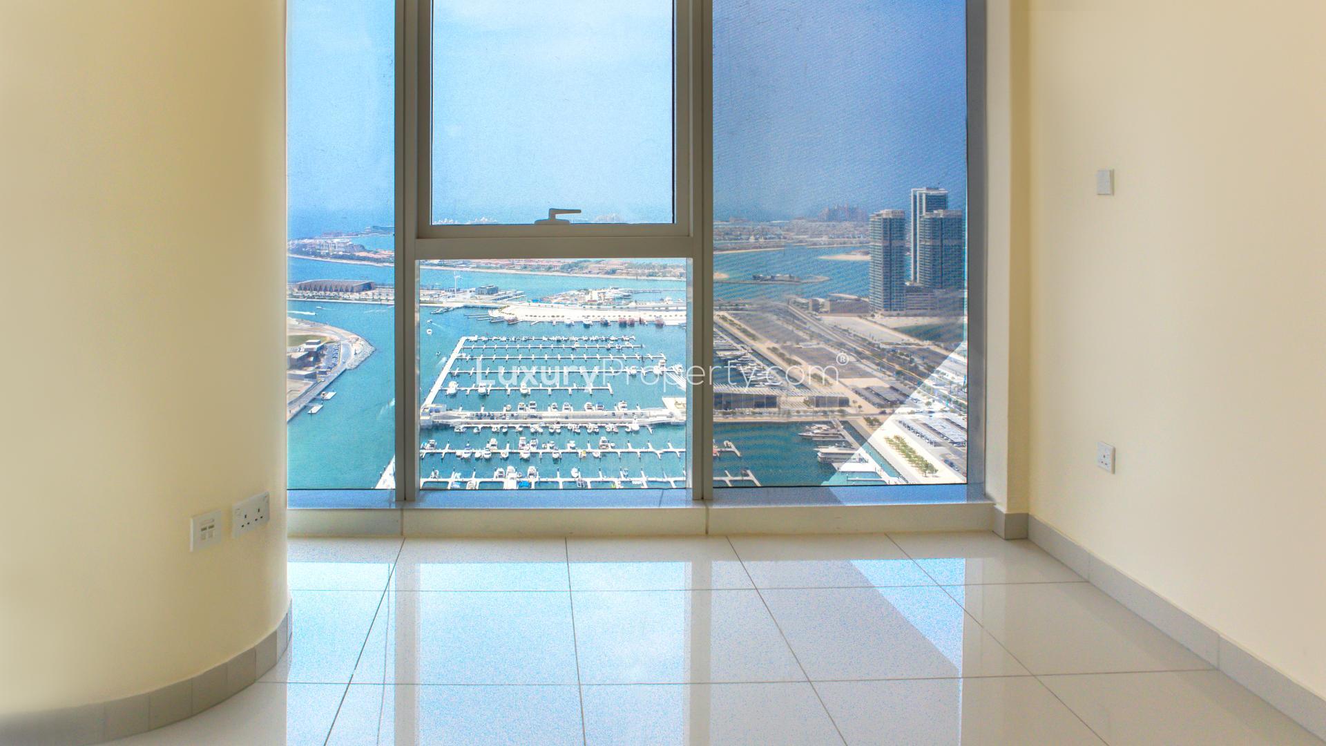 "Bright room with sea view in Damac Heights, Dubai Marina apartment for rent.",Sea view from modern apartment in Damac Heights, Dubai Marina, with marina and skyline
