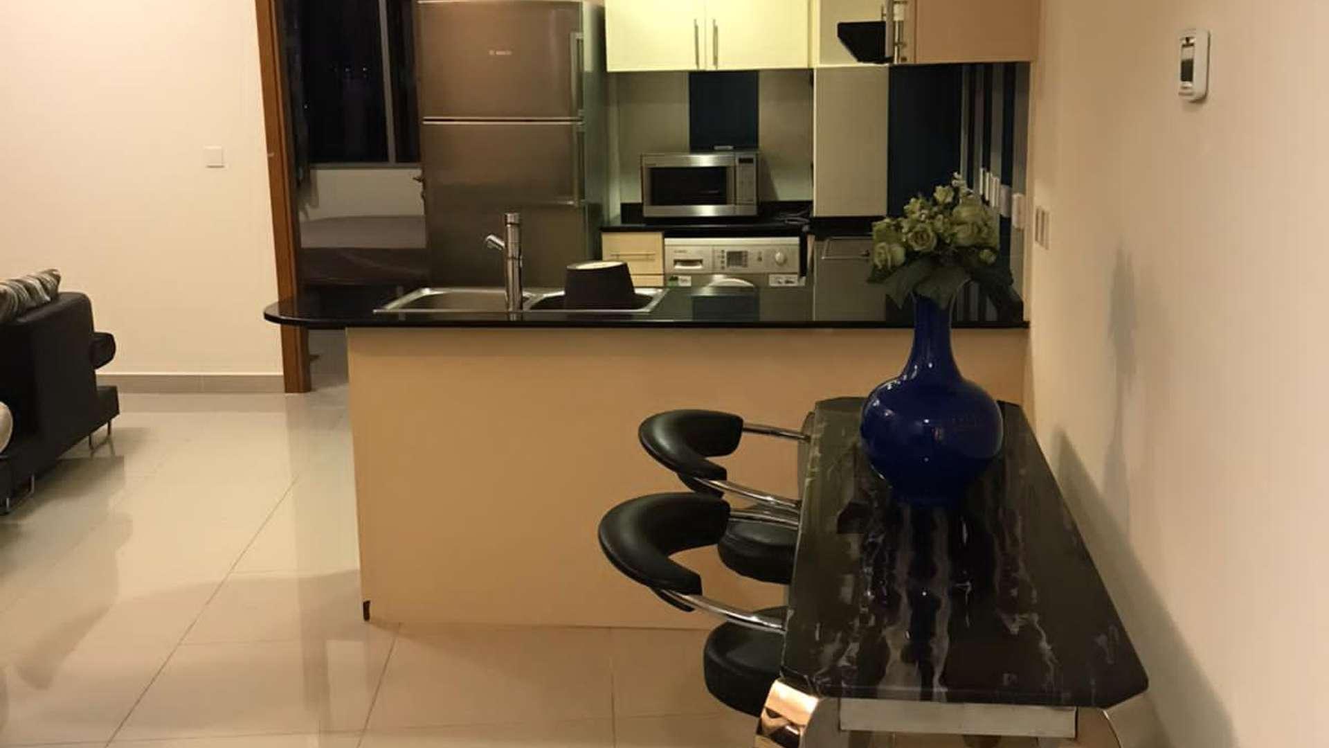 Modern kitchen and living area in fully furnished Dubai Marina apartment, Ocean Heights