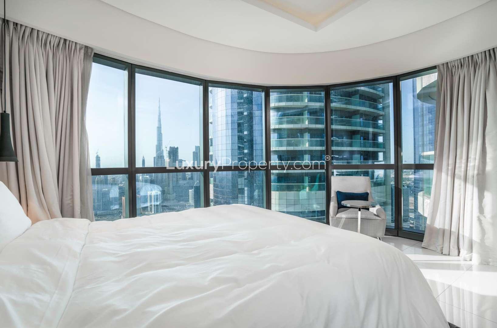 Luxurious bedroom in Damac Paramount Towers apartment, Business Bay, with modern decor and balcony