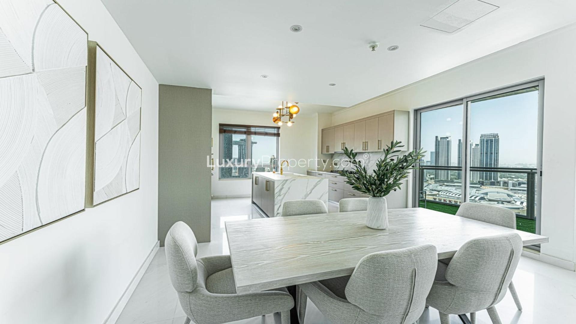 Spacious living room in Downtown Dubai apartment with city views, modern decor, and large windows