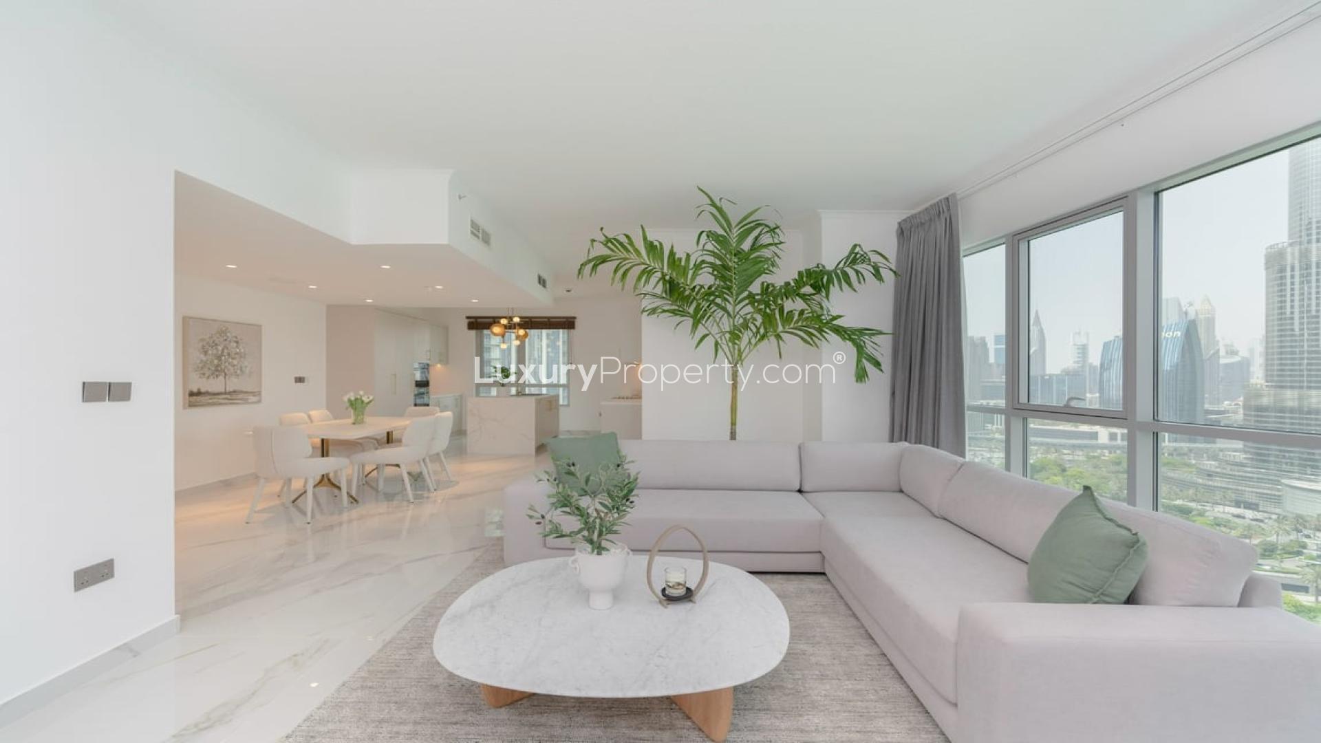 Stylish Downtown Dubai apartment interior with Burj Khalifa view, modern dining and living area
