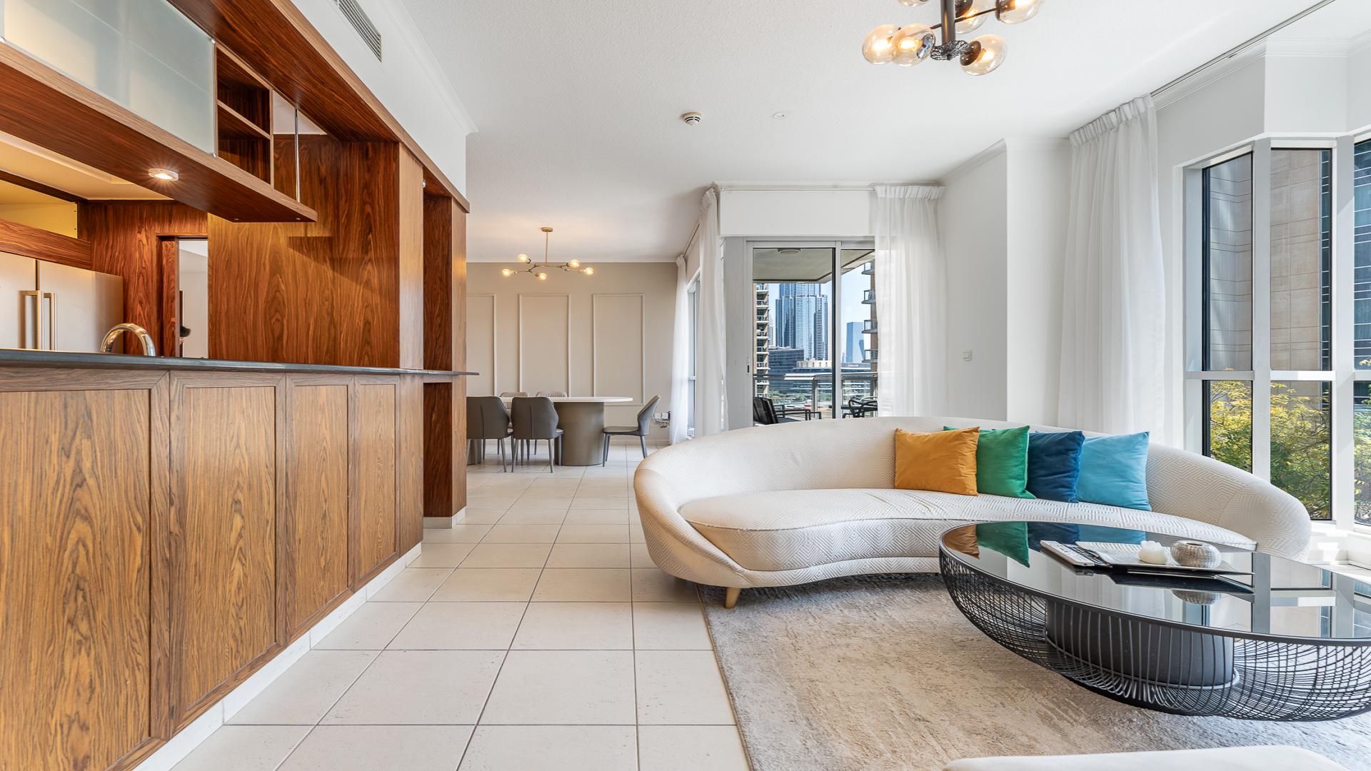 Modern living room in 3-bedroom Downtown Dubai apartment with city views and elegant decor