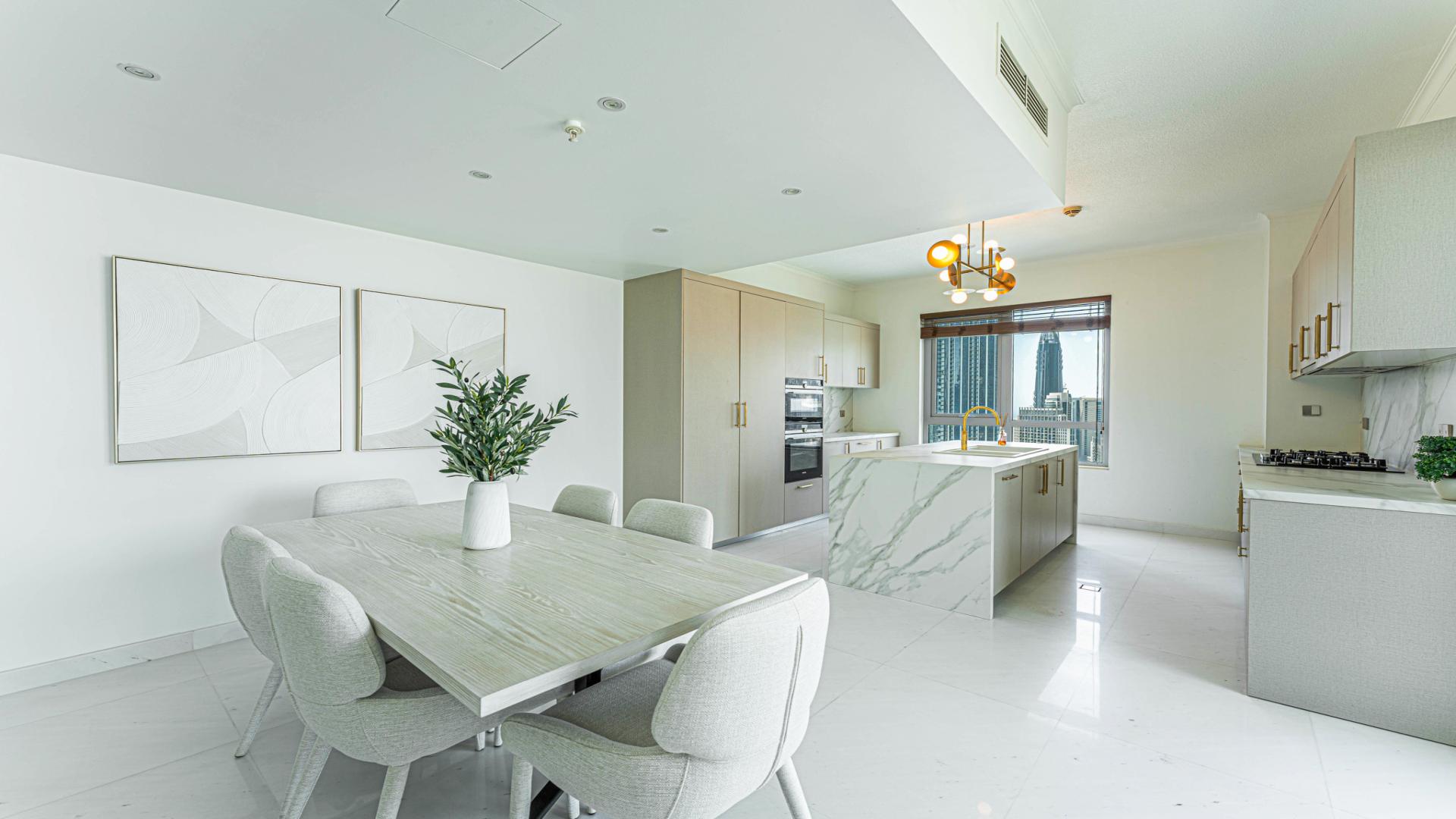 Modern kitchen and dining area in 3-bedroom apartment, The Residences, Downtown Dubai