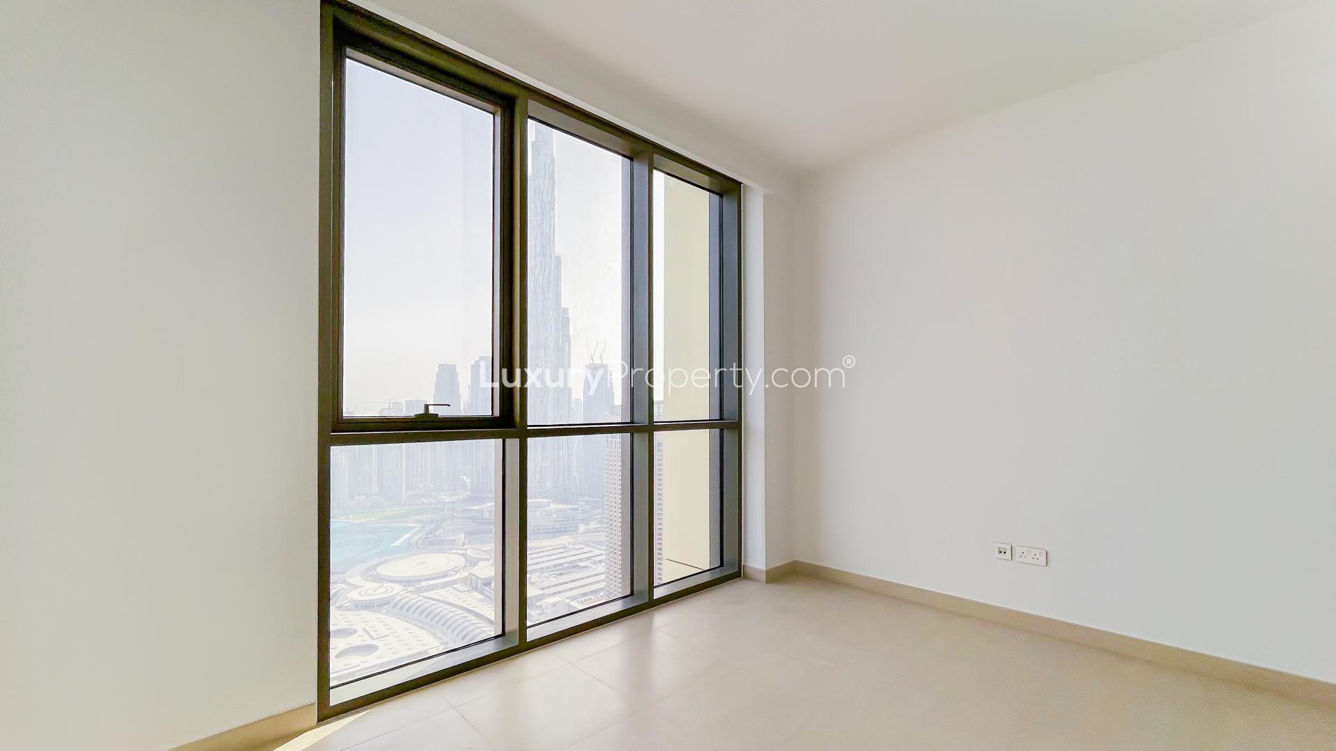 Empty room with large window overlooking Downtown Dubai and Burj Khalifa view